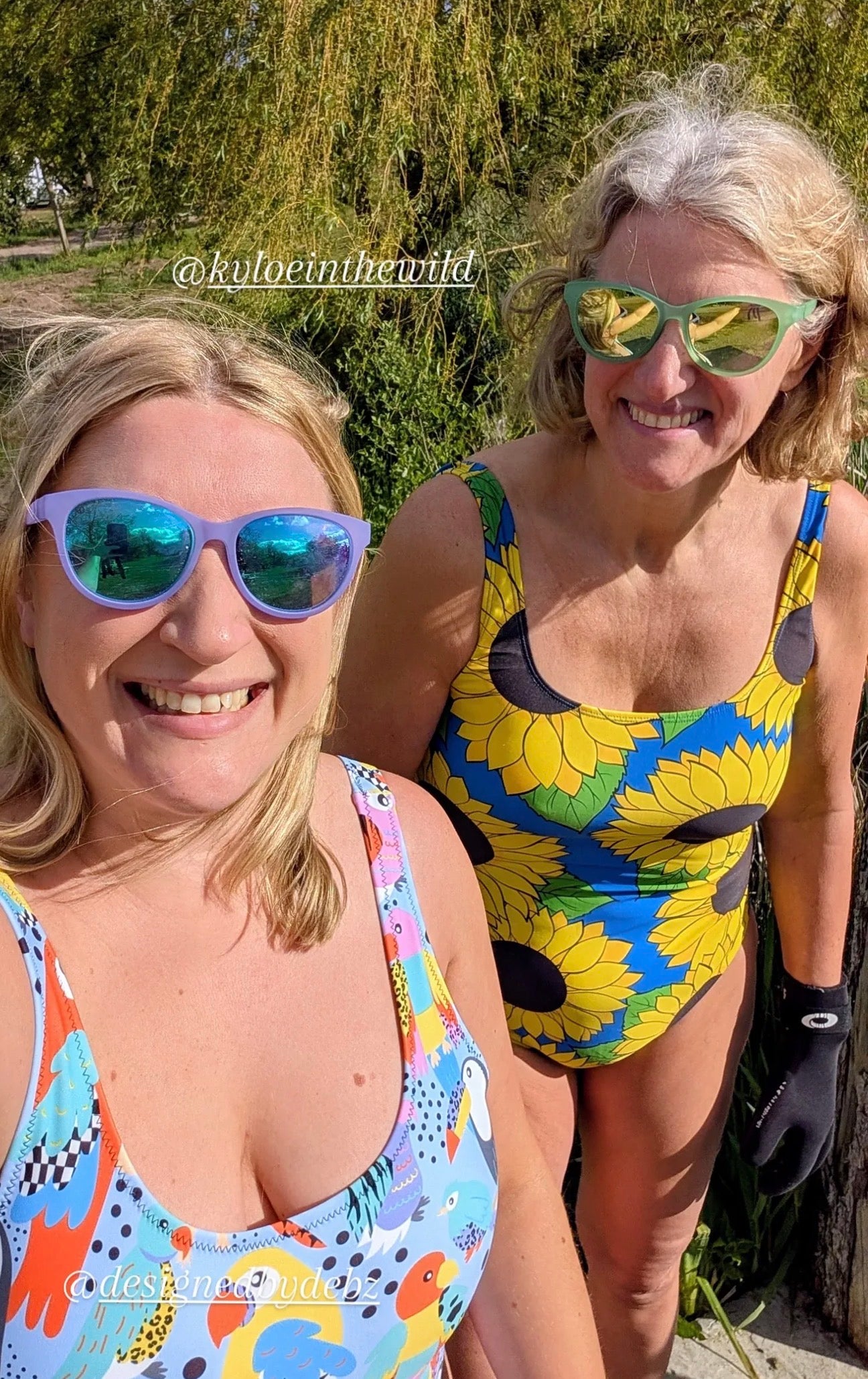 Handmade Tropical Birds Swimsuit by Printful, UPF 50+ recycled one-piece swimsuit with vibrant tropical bird design on model.