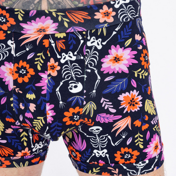 Organic cotton boxers with a dancing skeleton print from Designed By Debz, featuring a comfortable fit and fun spooky design.