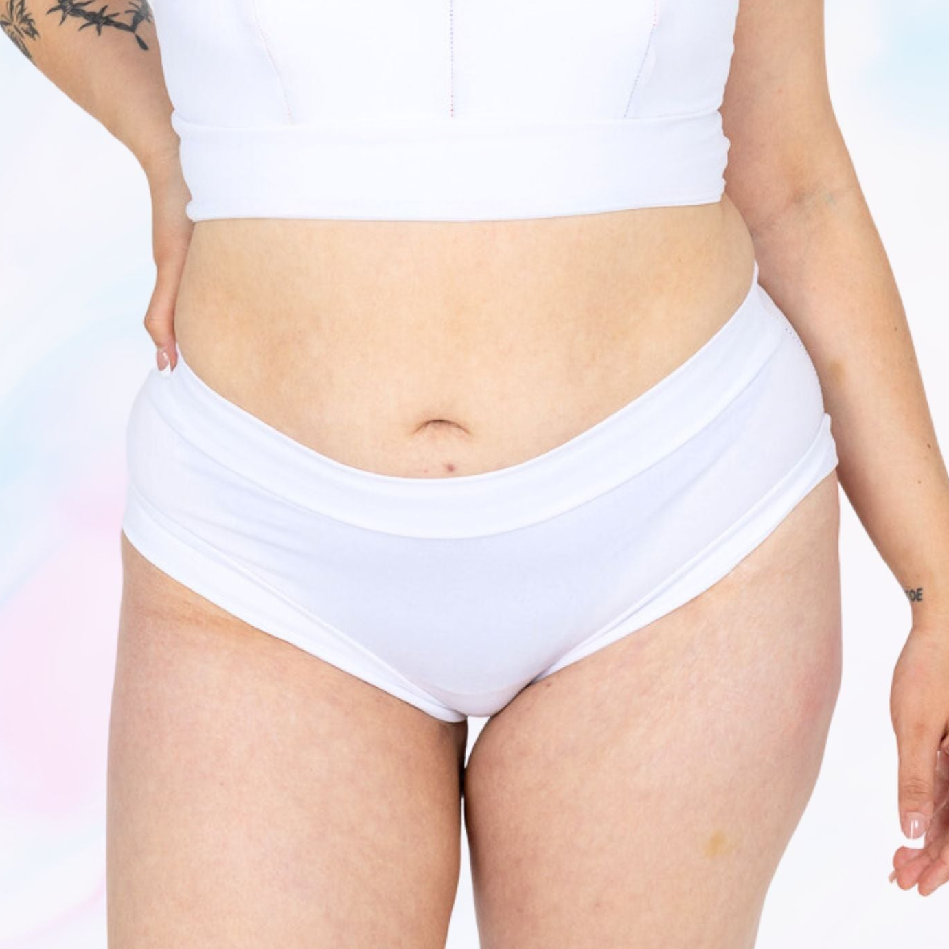 White organic cotton briefs by Designed By Debz featuring soft, stretchy, neutral-colored fabric for comfortable everyday wear.