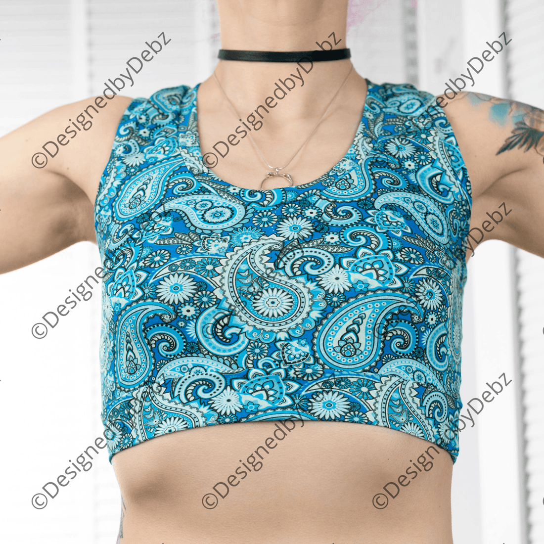 Blue paisley print Comfort Bralette by Designed By Debz made of organic cotton, shown on a model with soft fabric details.