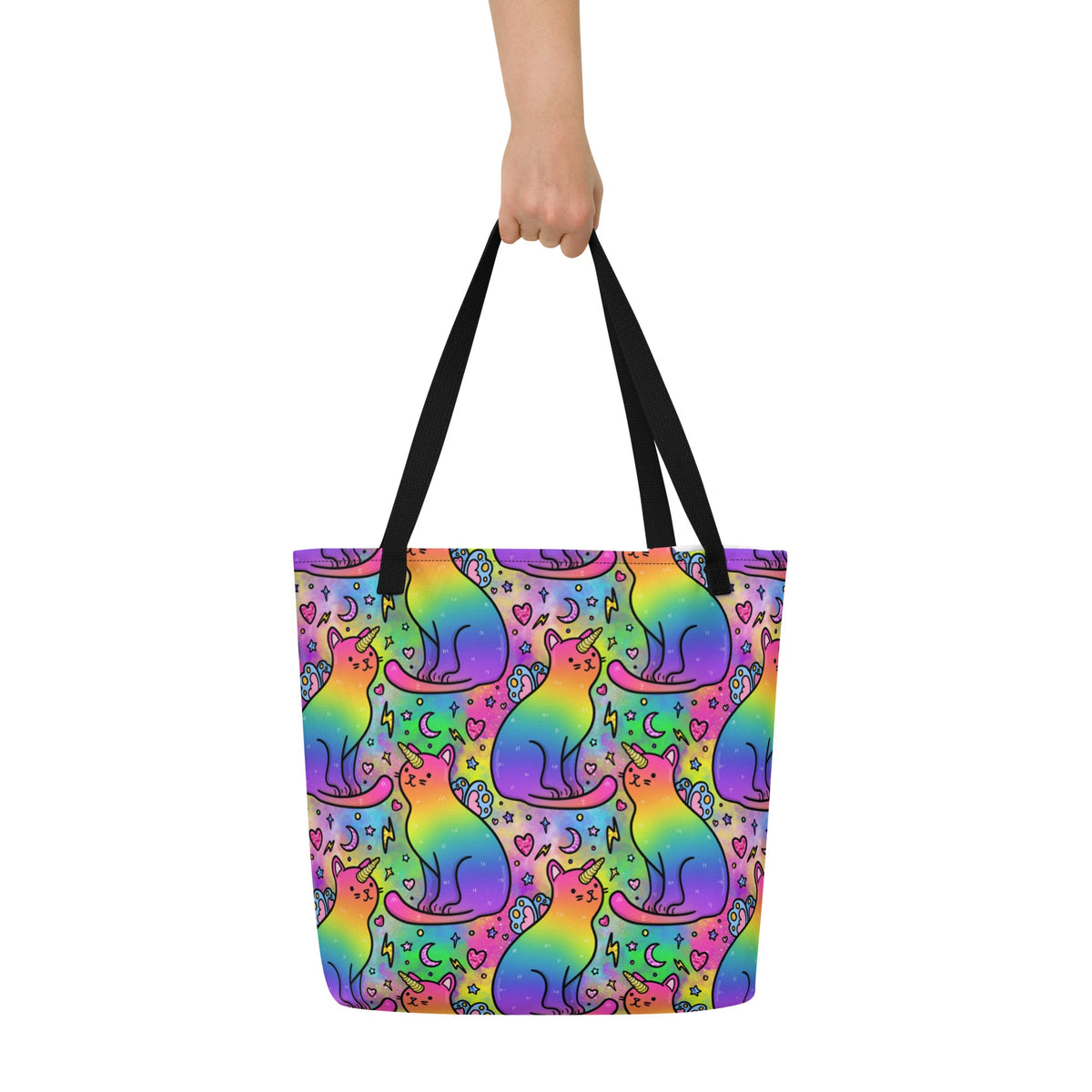 Large tote bag featuring colorful rainbow unicorn cats print, black fabric with front pocket, designed by Debz.
