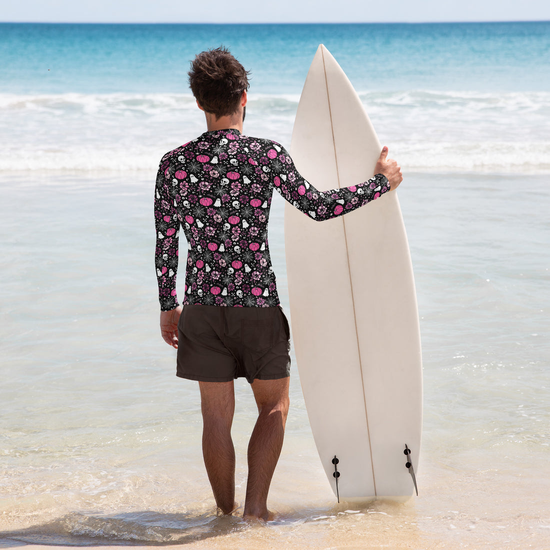 Men's pink Halloween-themed long sleeve rash guard by Printful with all-over print and UPF 50+ protection, shown from the back.