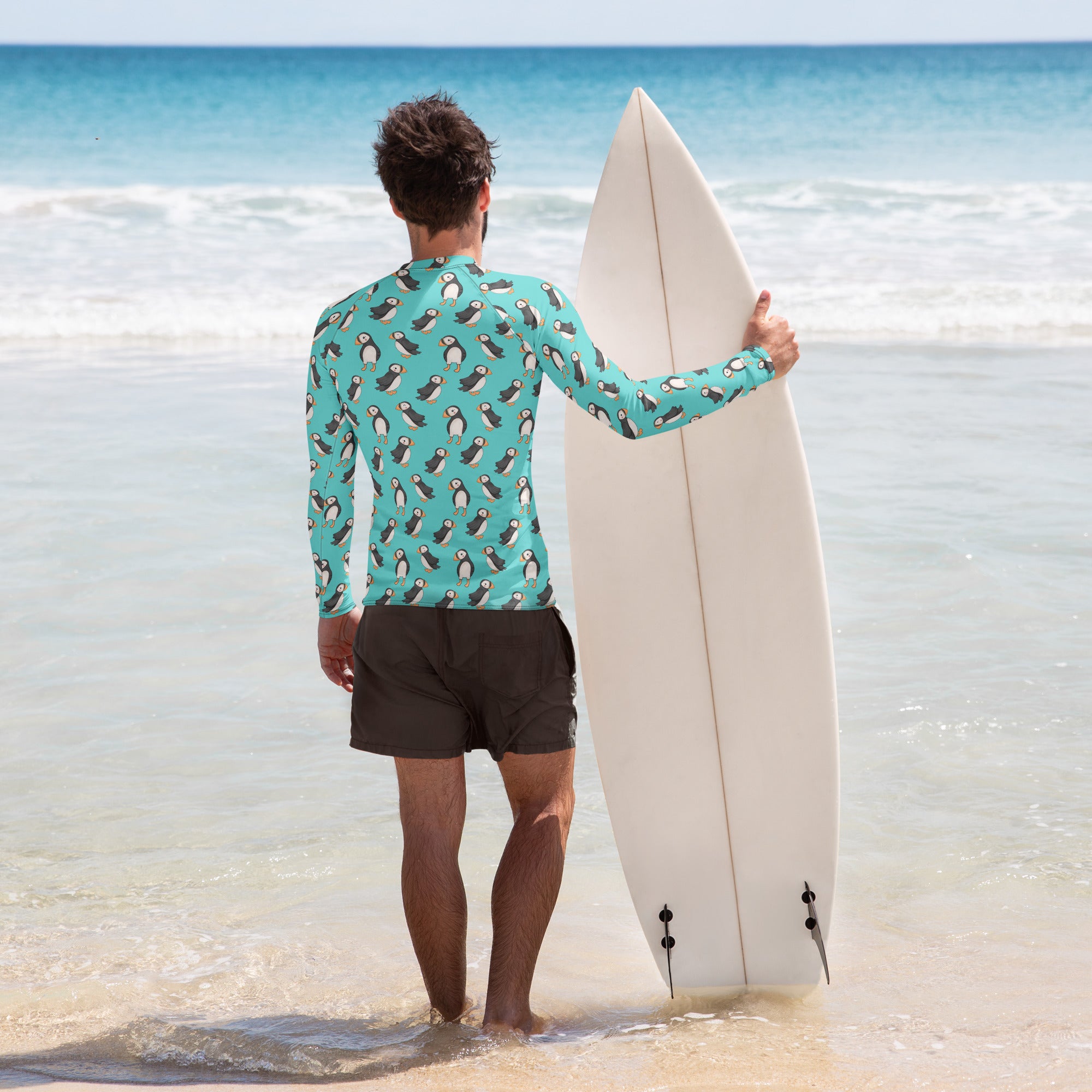 Unisex Puffin Recycled Long Sleeve Rash Guard by Printful with all-over white print and vibrant design on the back.