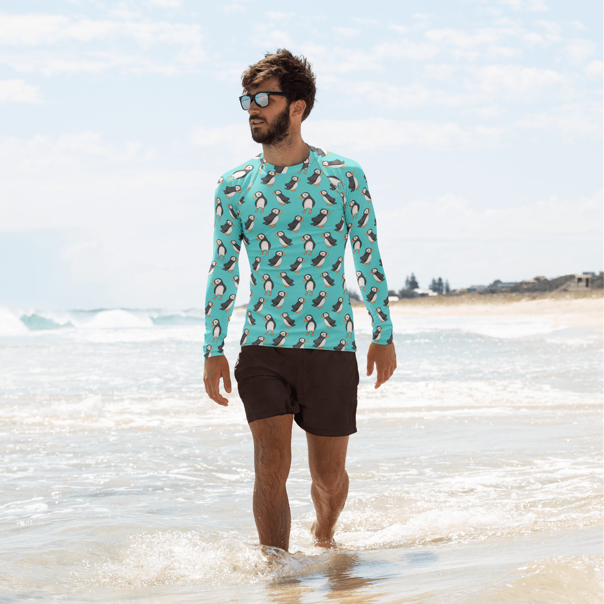 Unisex Puffin recycled long sleeve rash guard with all-over print in white, designed for sun protection and active wear.