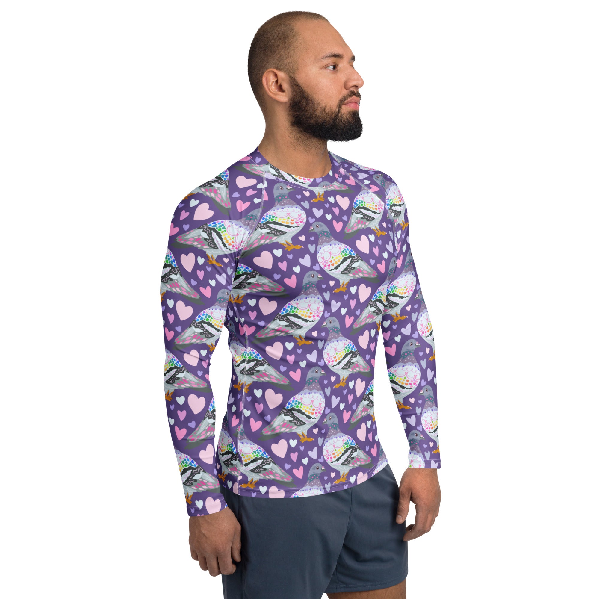 All-over-print white unisex long sleeve rash guard by Pigeon Love, made from recycled material, featuring vibrant design.