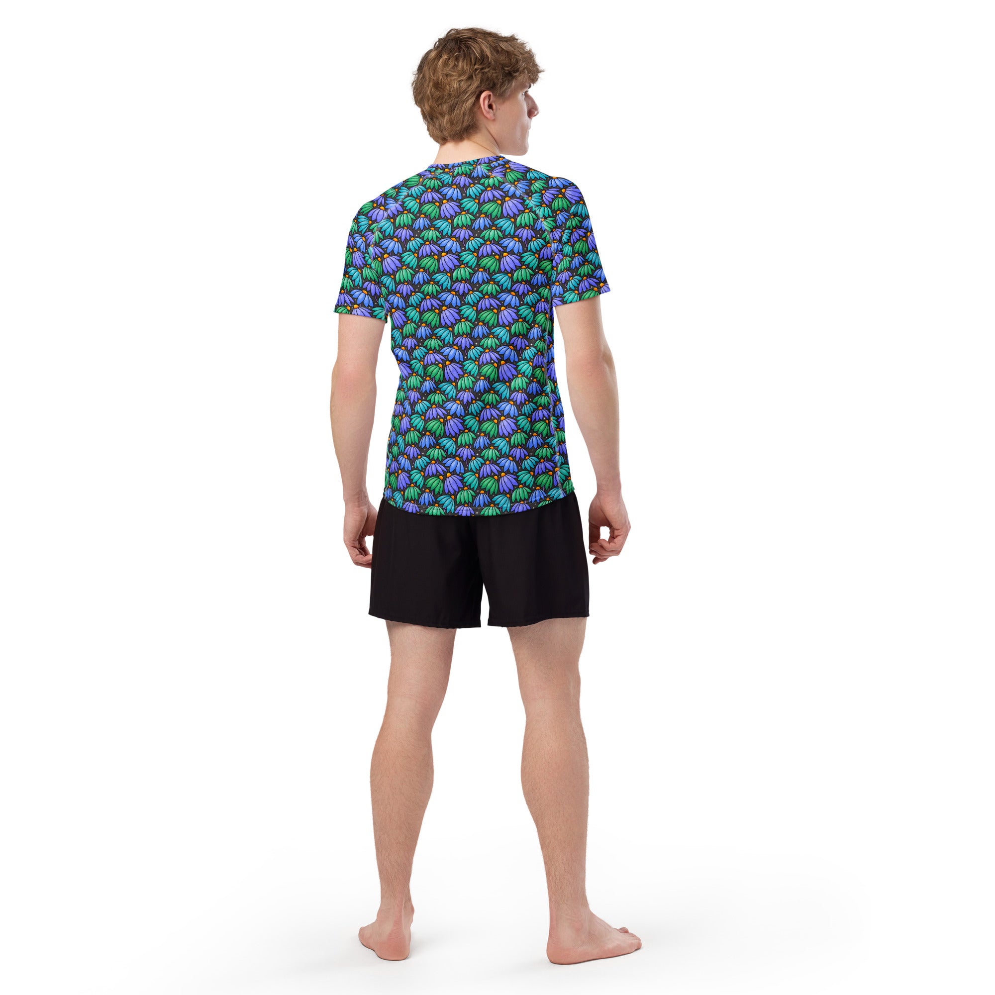 Printful men's all-over print white short sleeve rash guard with colorful floppy flower pattern, made from recycled materials.