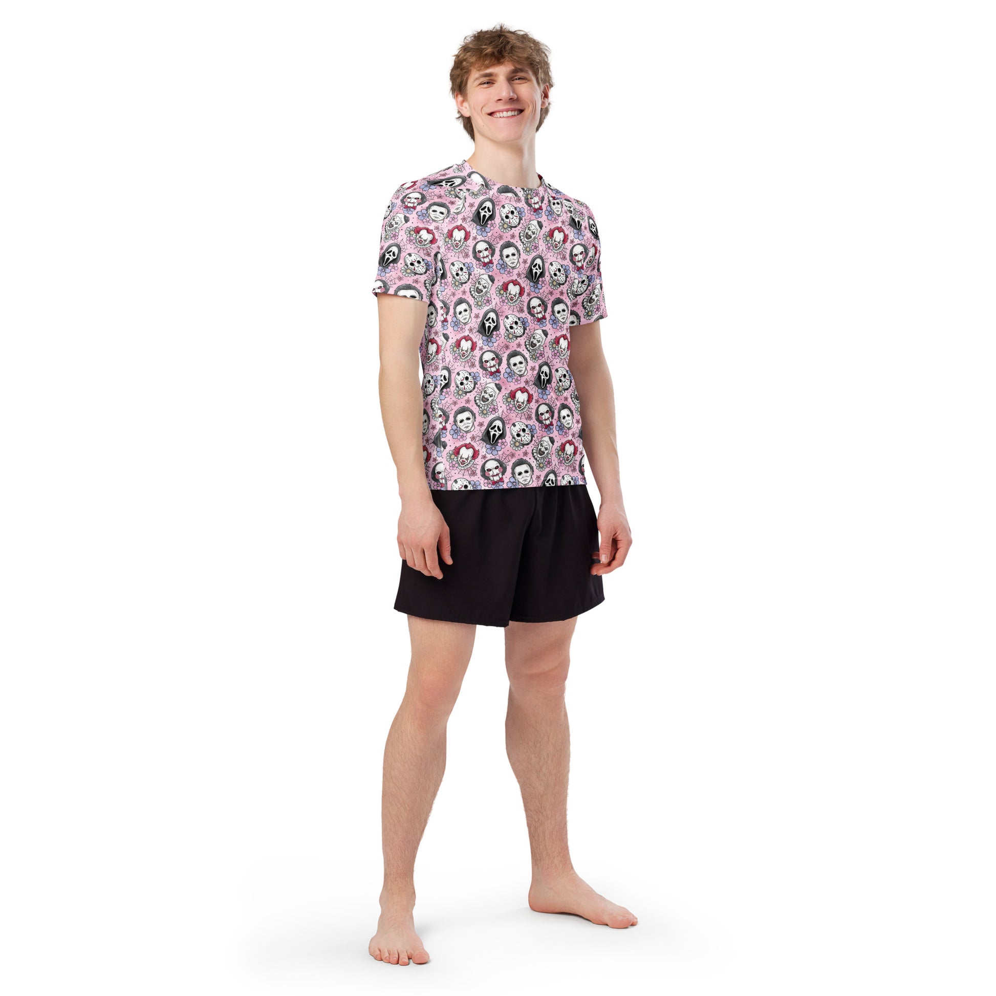 Pink Horror Characters all-over print unisex short sleeve rash guard by Printful, featuring vibrant pink horror designs on white fabric.