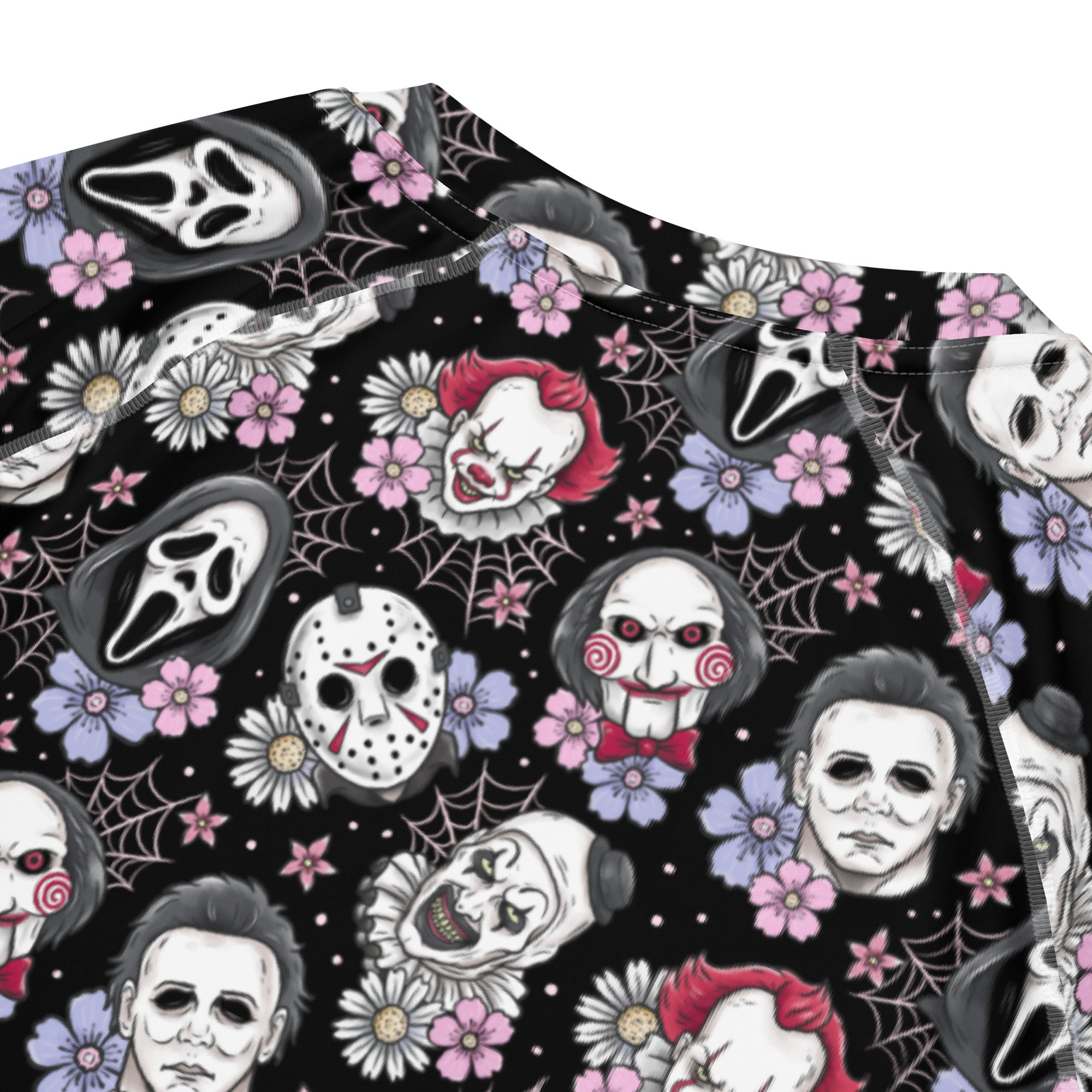 Black horror characters all-over print unisex short sleeve rash guard with spooky design, made from recycled material, by Printful.