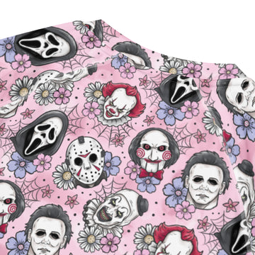Unisex pink horror characters all-over print short sleeve rash guard by Printful with vibrant pink horror designs on white fabric.
