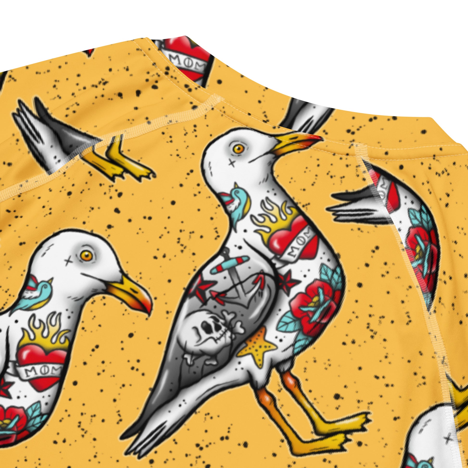 Yellow Nautigul seagull all-over print unisex short sleeve rash guard with ocean-inspired design, made from recycled materials.
