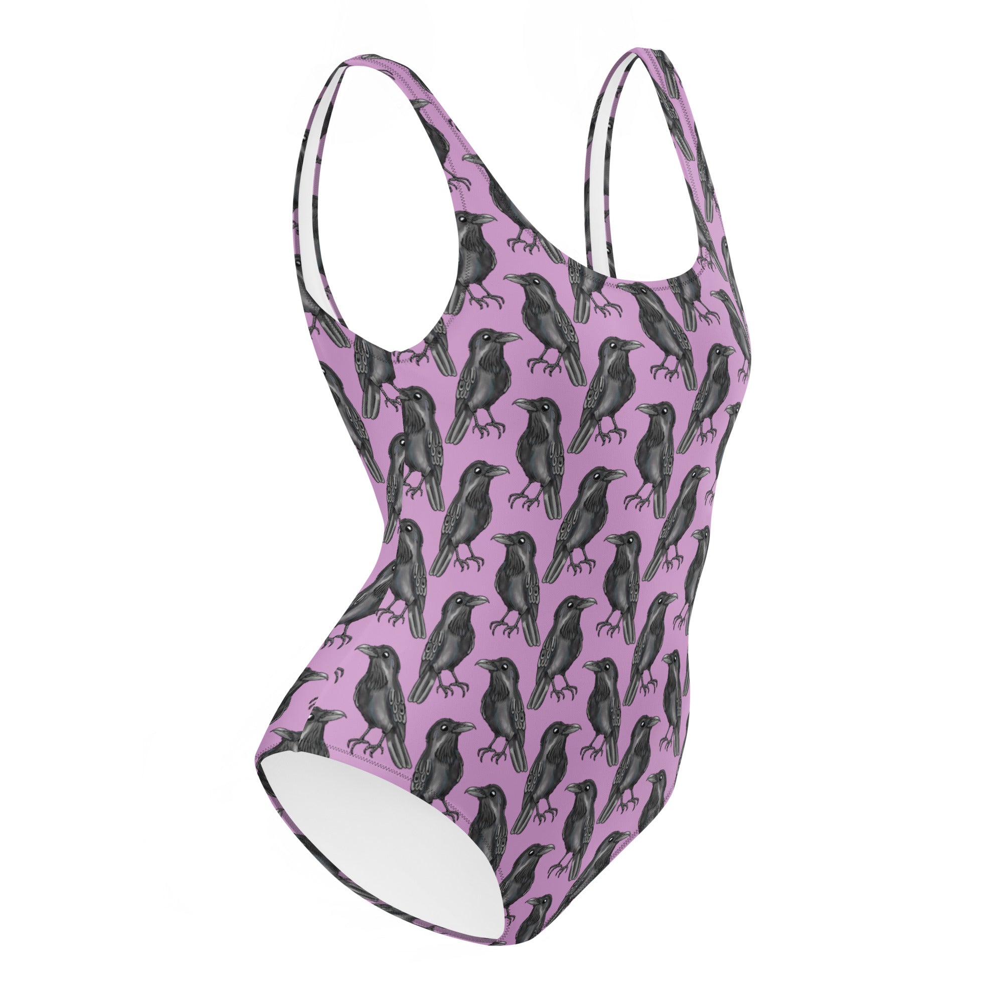 Lilac one-piece swimsuit with gothic crow print from Printful, featuring an all-over black crow design on a white background.