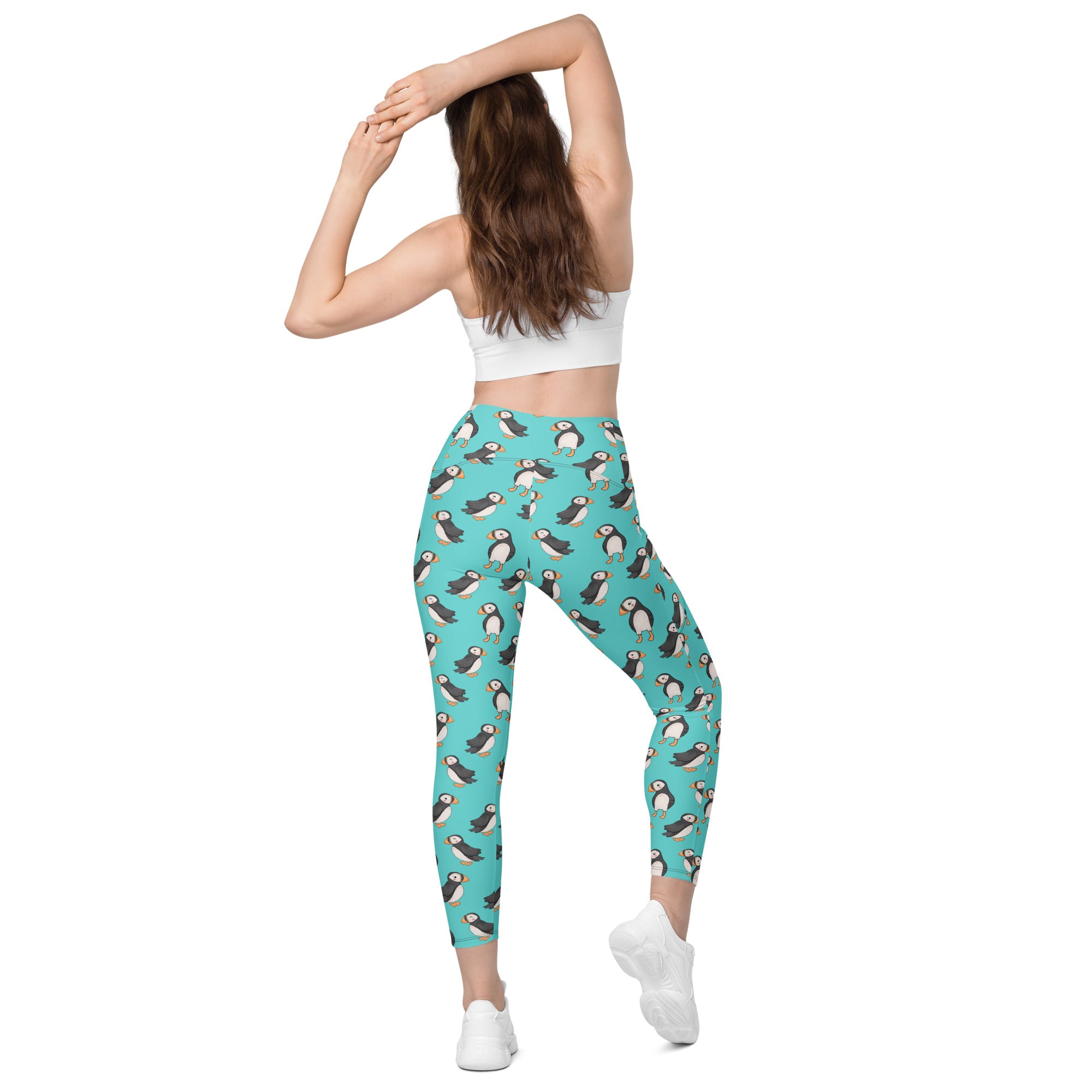 Printful Puffin Party crossover leggings with pockets, all-over print, recycled fabric, shown from the back in white.