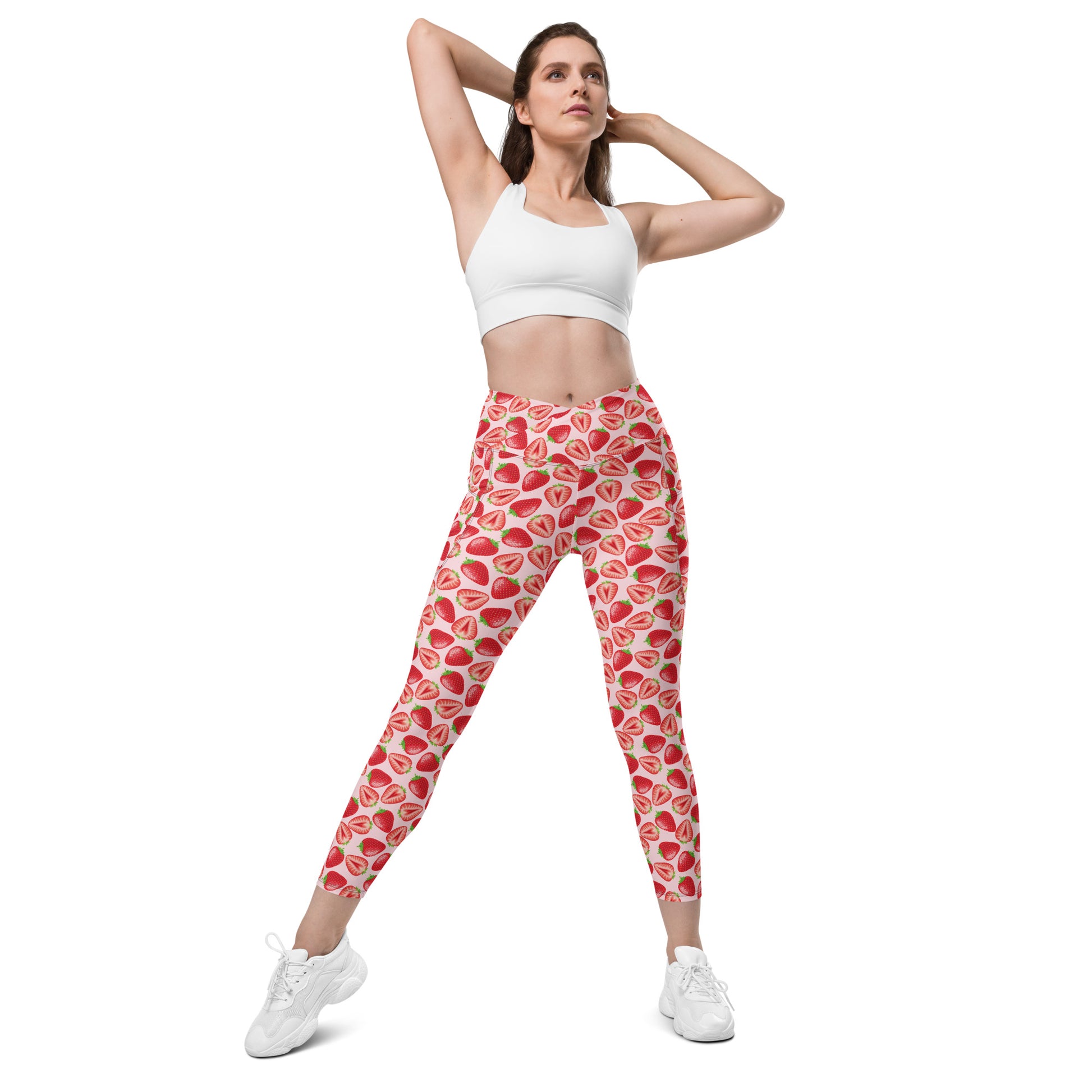Printful crossover leggings with wild strawberry print, features pockets, all-over recycled fabric, white front view in size 2XS-6XL.