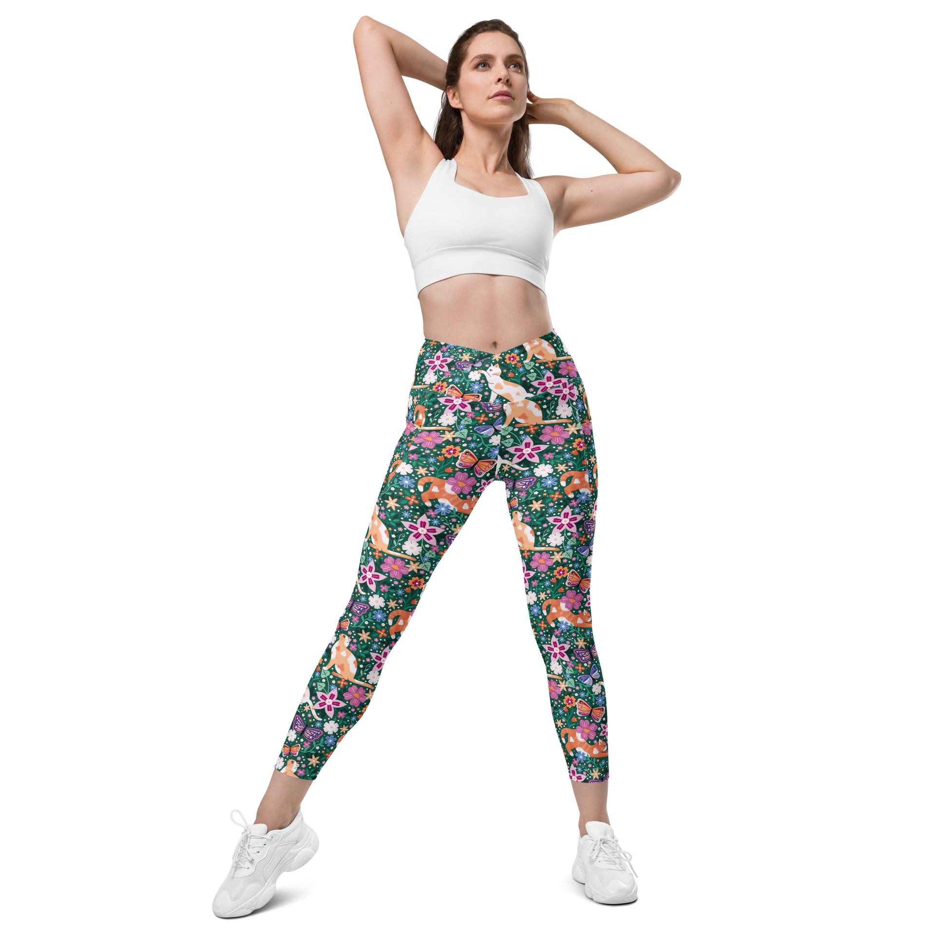 White Garden Familiar Cat crossover leggings with pockets featuring all-over print, made by Printful.