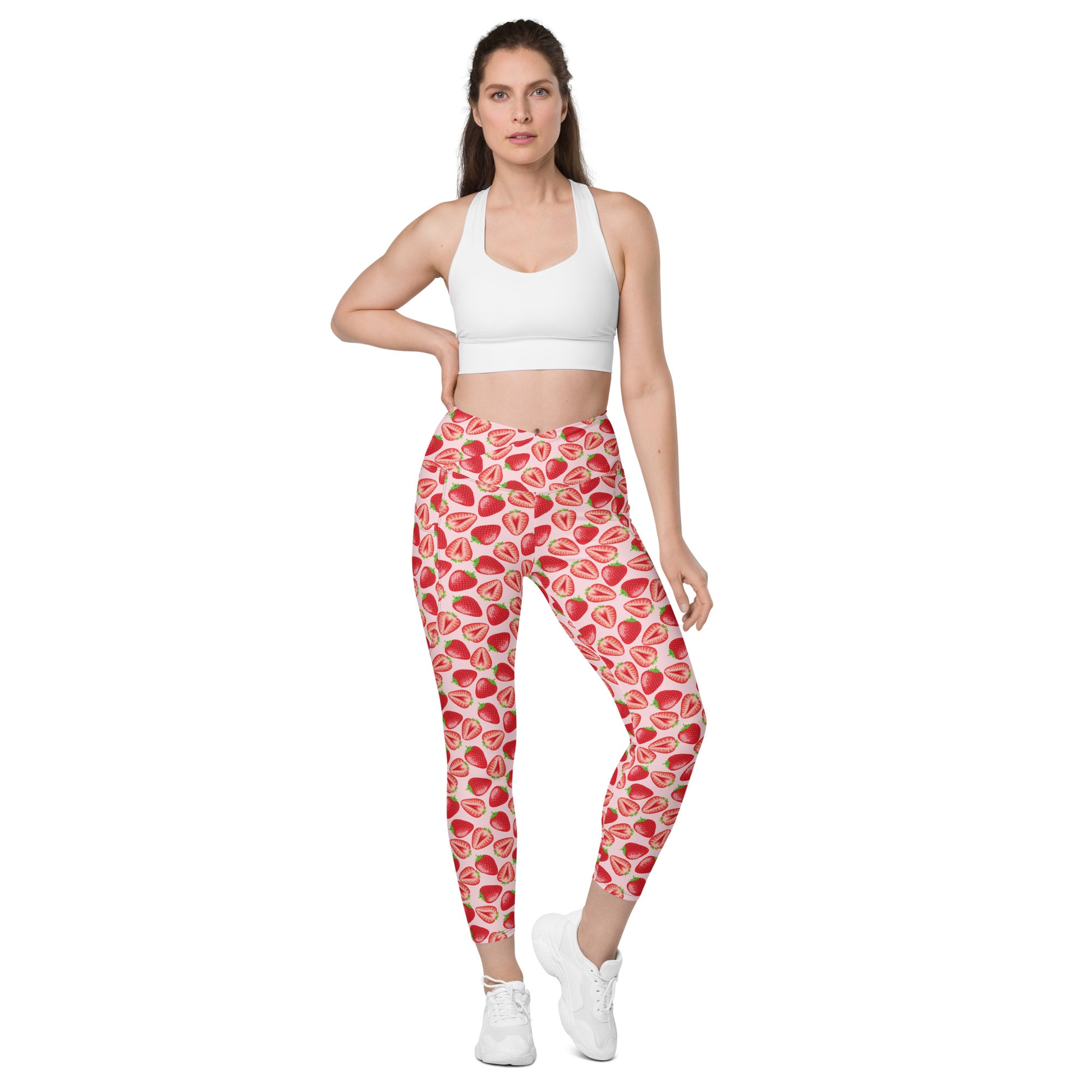 Printful crossover leggings with wild strawberry print, pockets, all-over recycled fabric, front view, available in 2XS to 6XL sizes.