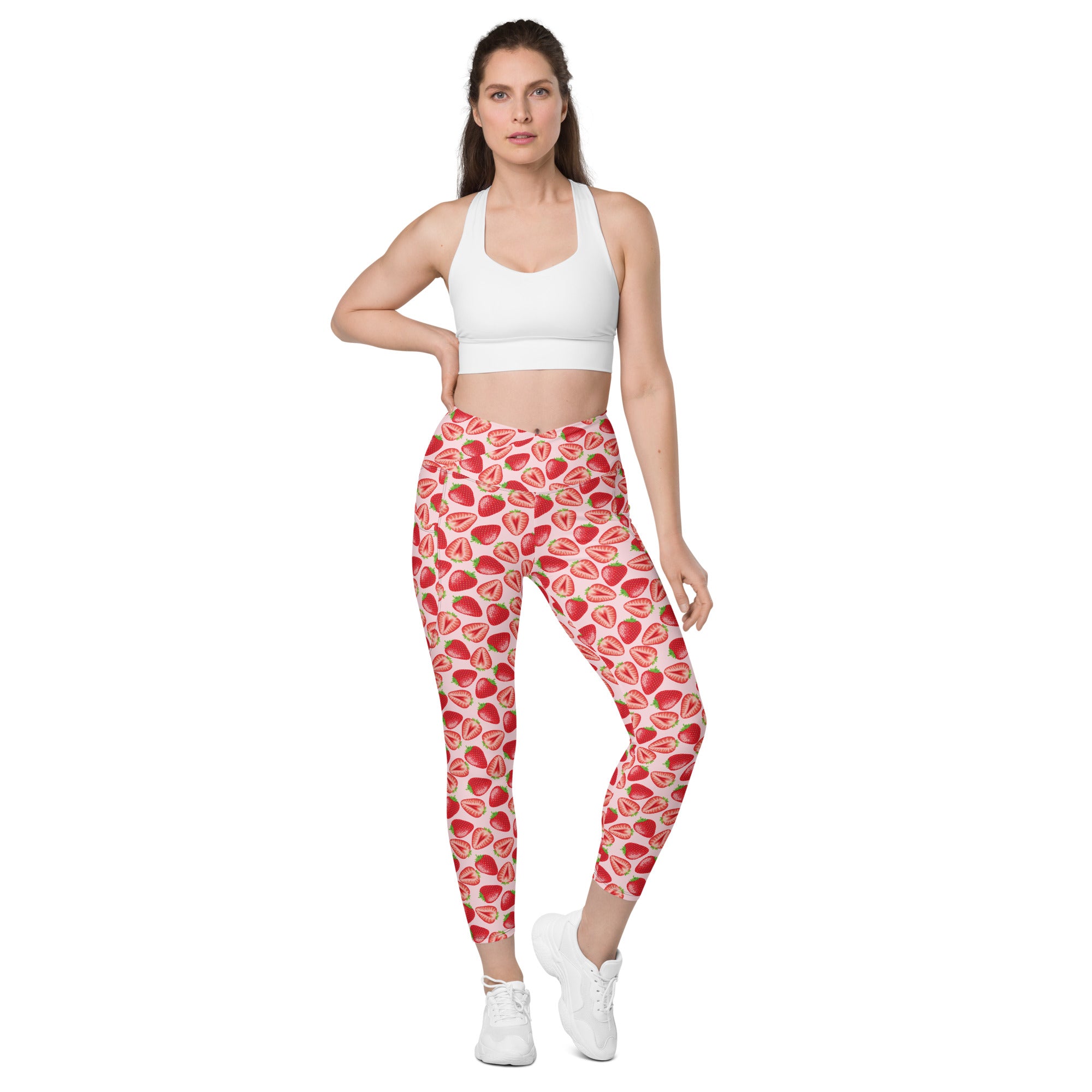 Printful crossover leggings with wild strawberry print, pockets, all-over recycled fabric, front view, available in 2XS to 6XL sizes.
