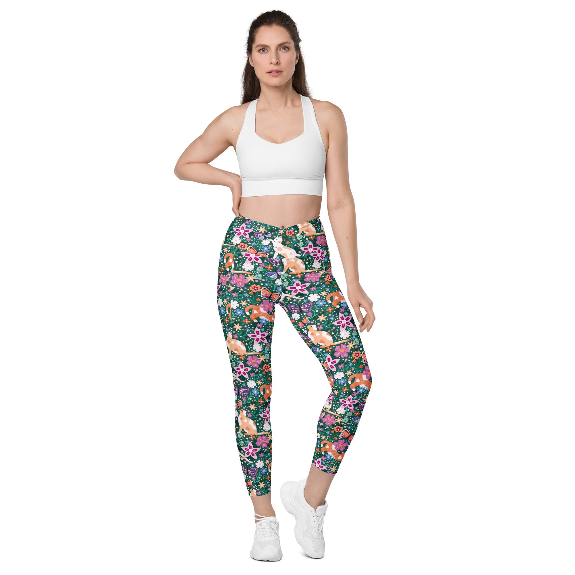 Printful Garden Familiar Cat crossover leggings with pockets featuring an all-over white floral print on recycled fabric.