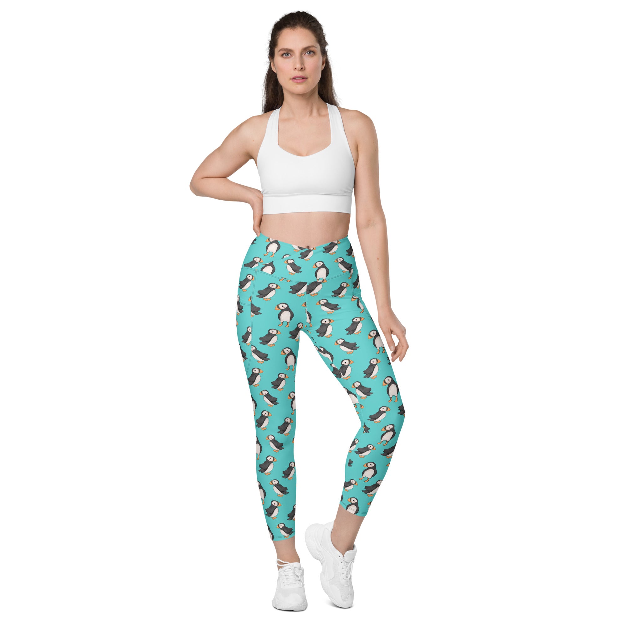 Printful Puffin Party crossover leggings with pockets featuring a colorful all-over puffin print on white background.