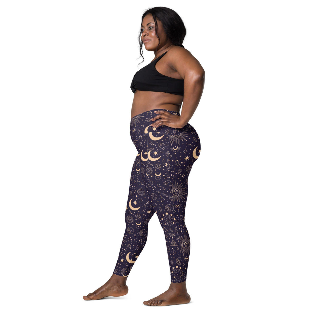 Printful Celestial Goddess crossover leggings with all-over celestial print and side pockets, made from recycled fabric fabric.