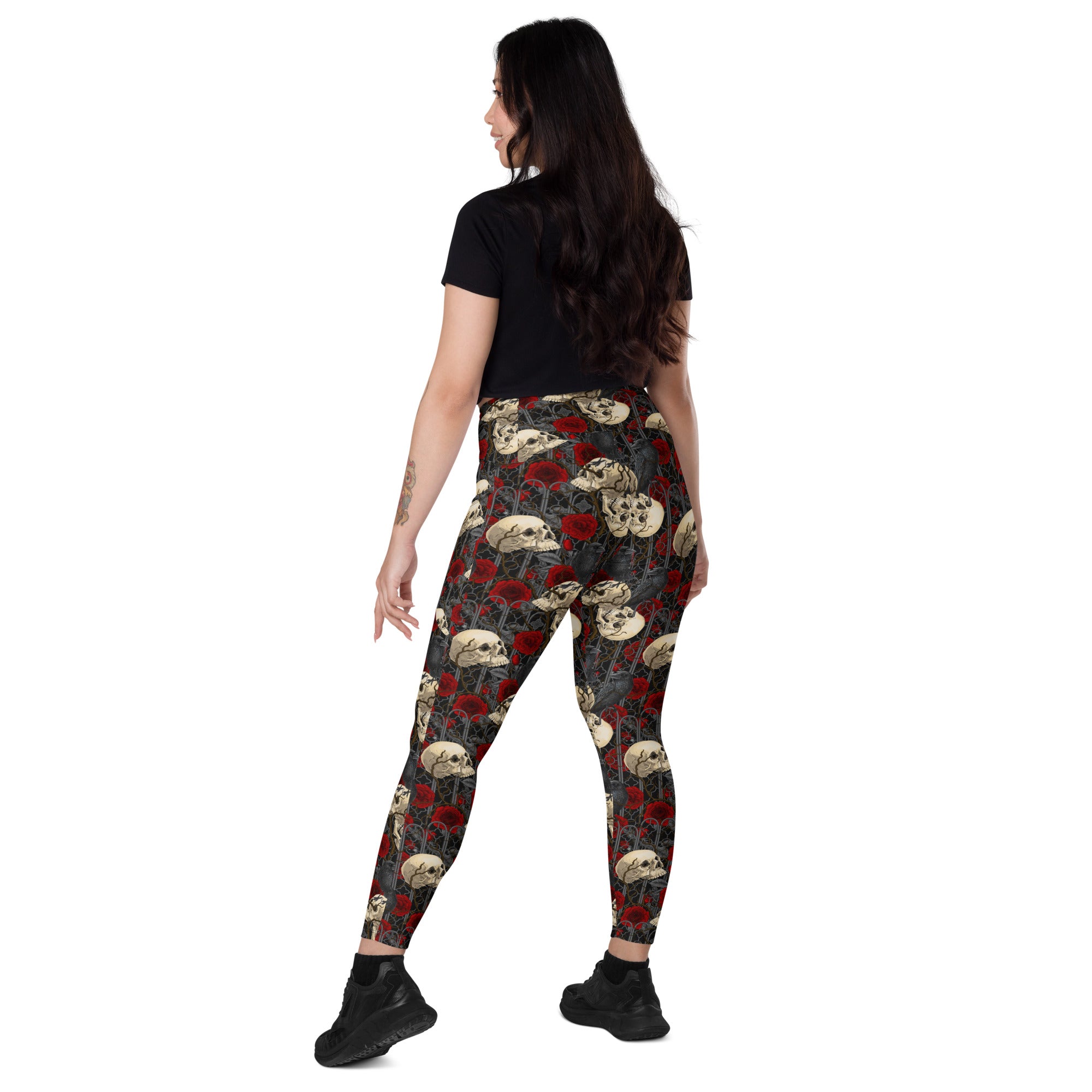 Printful DBD x Katarina Mitkova crossover leggings with pockets featuring all-over white recycled print, shown from back left angle.