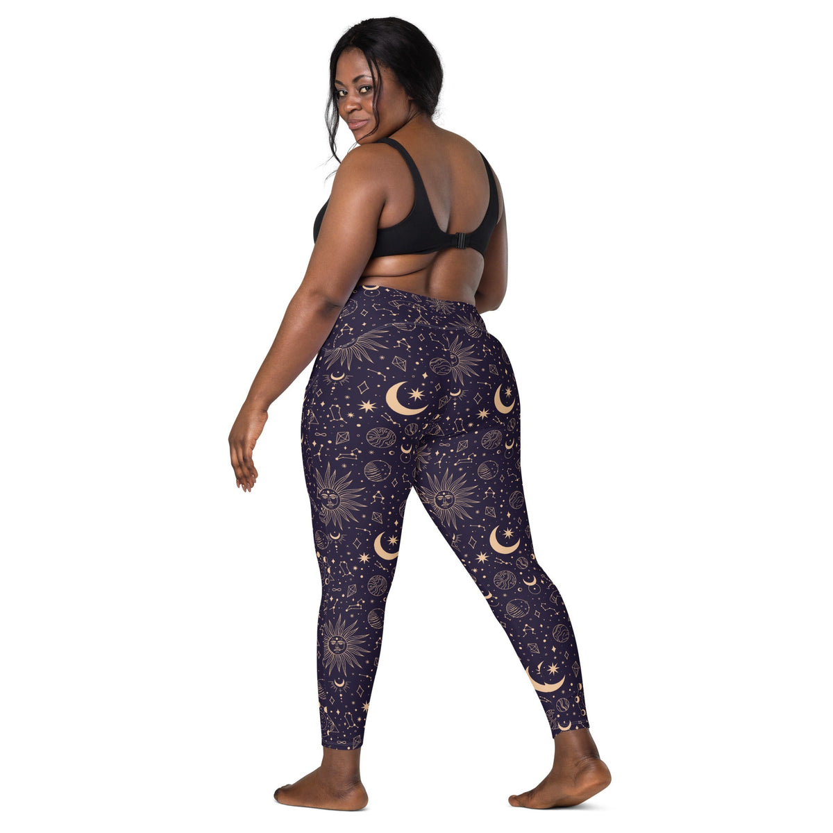 Printful Celestial Goddess crossover leggings with pockets, featuring all-over celestial print on white recycled fabric, back view.