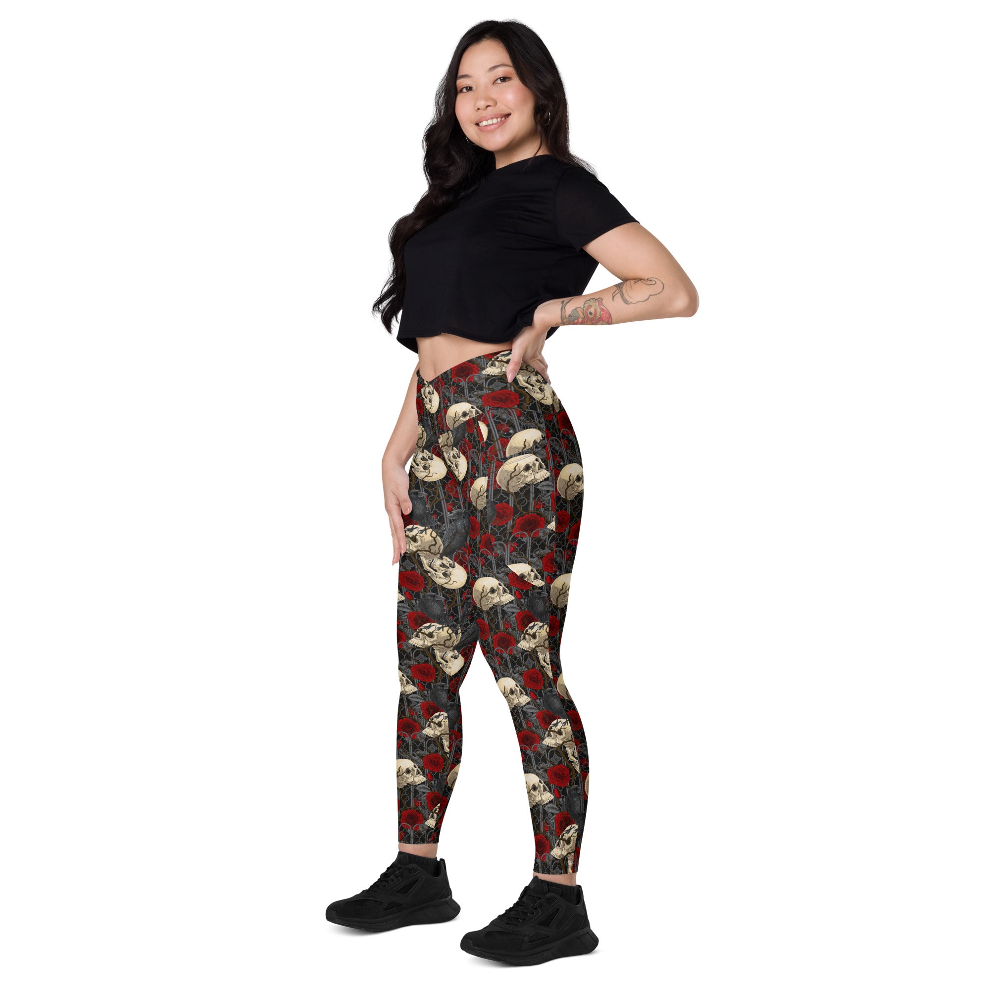 Printful DBD x Katarina Mitkova crossover leggings with pockets, all-over print in white, shown from the left front angle.