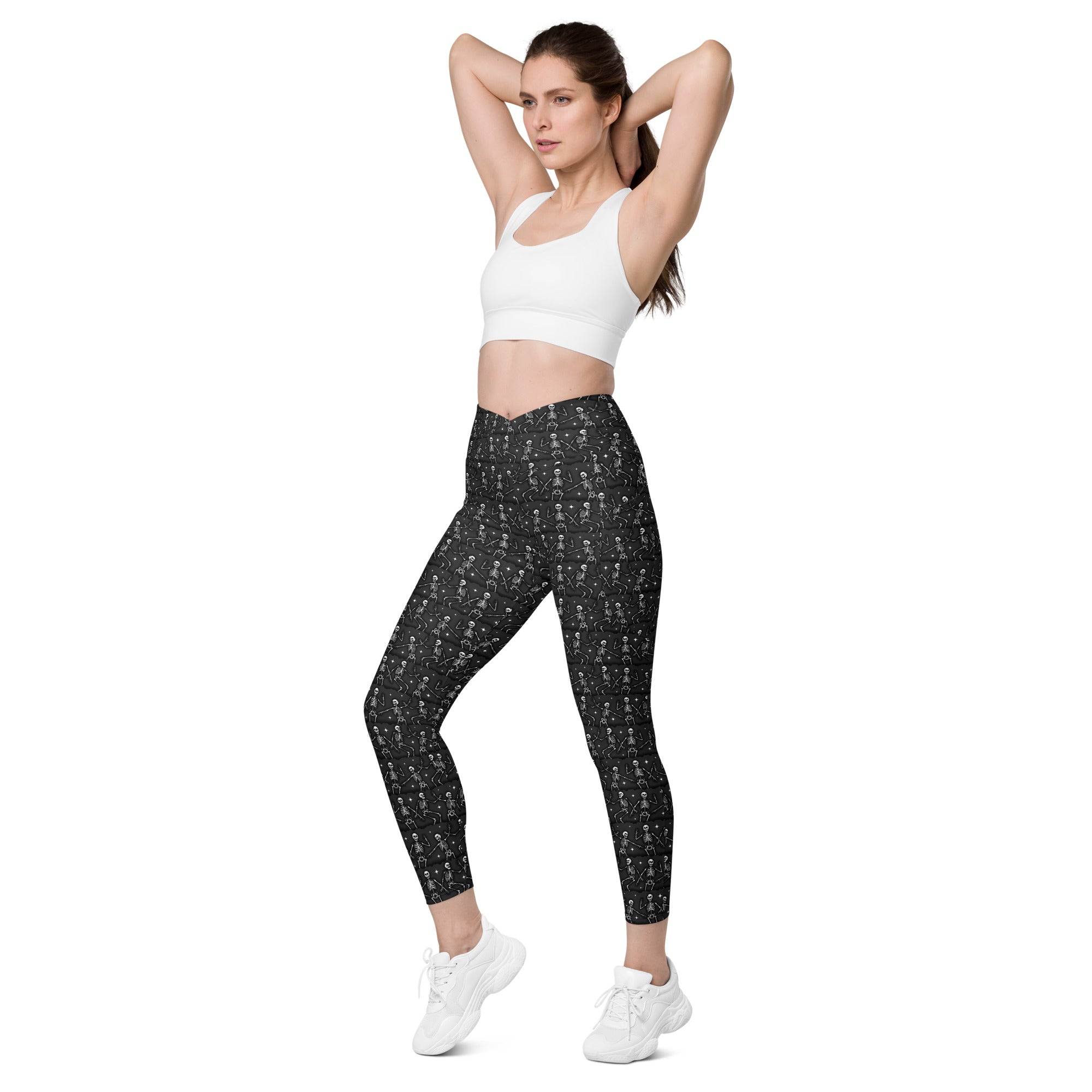Printful DBD x Waffle Mamma Bone Dance crossover leggings with all-over white print and side pockets, front view.
