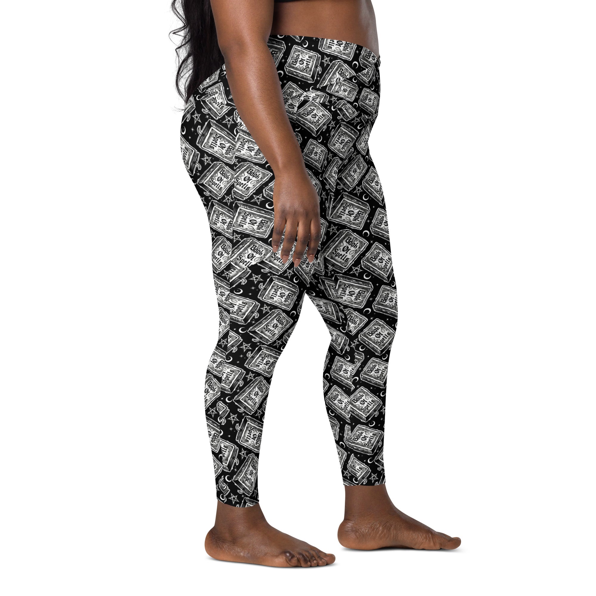White Book of Spells crossover leggings with pockets featuring all-over printed magical design from Printful.