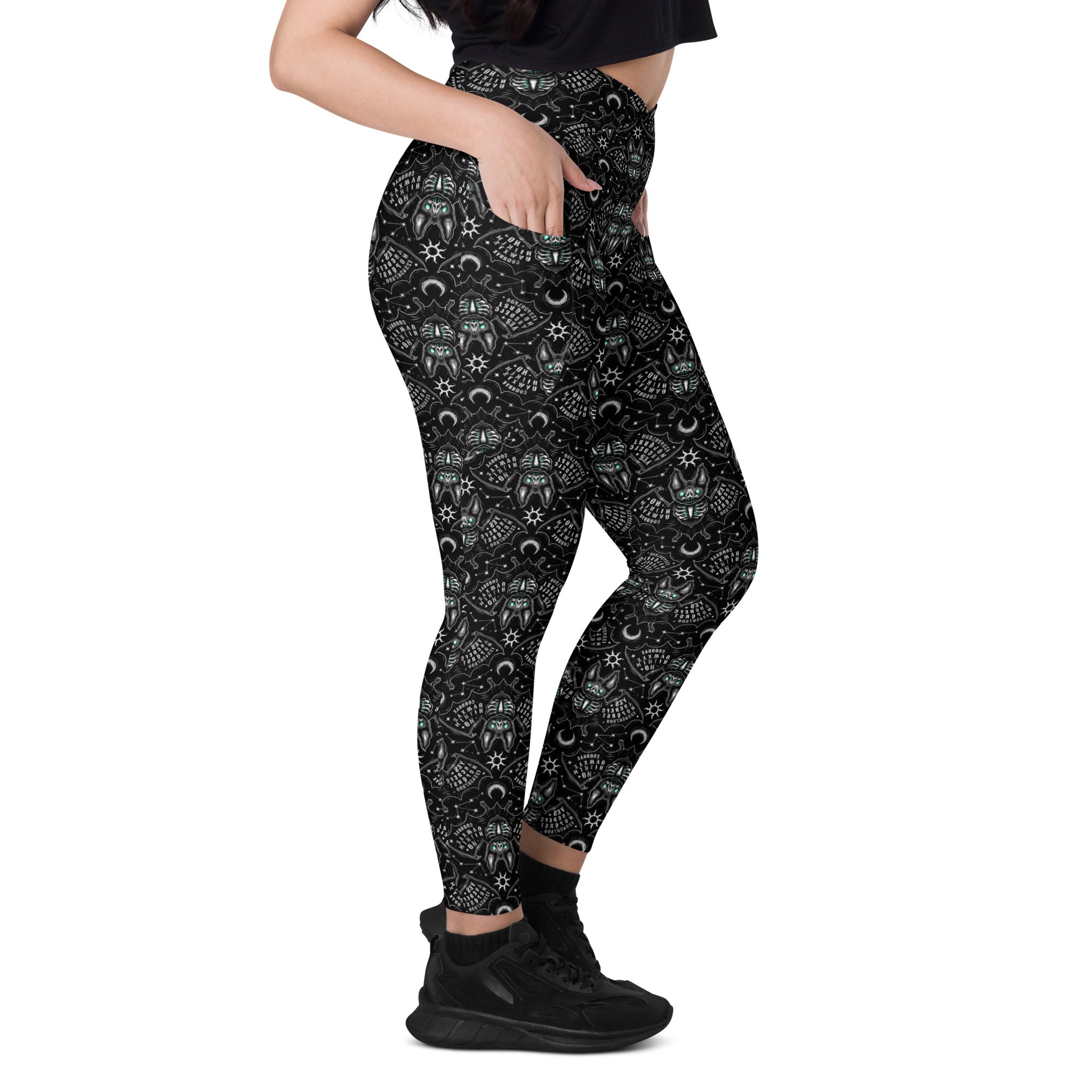 Printful Ouija Bats crossover leggings with all-over print, featuring pockets, in white recycled fabric and bold gothic design.