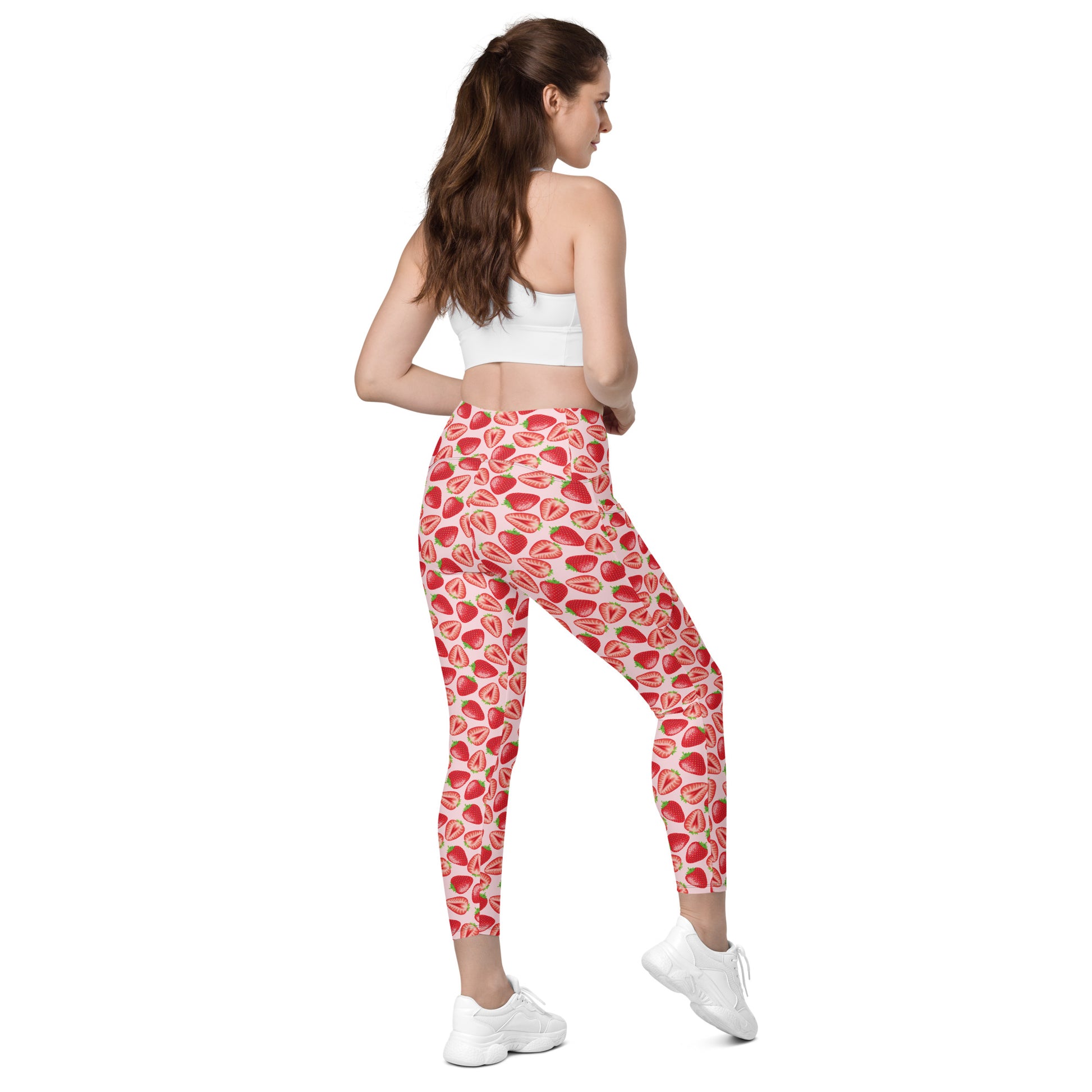 Printful crossover leggings with wild strawberry print, recycled fabric, pockets, shown from the right back side.
