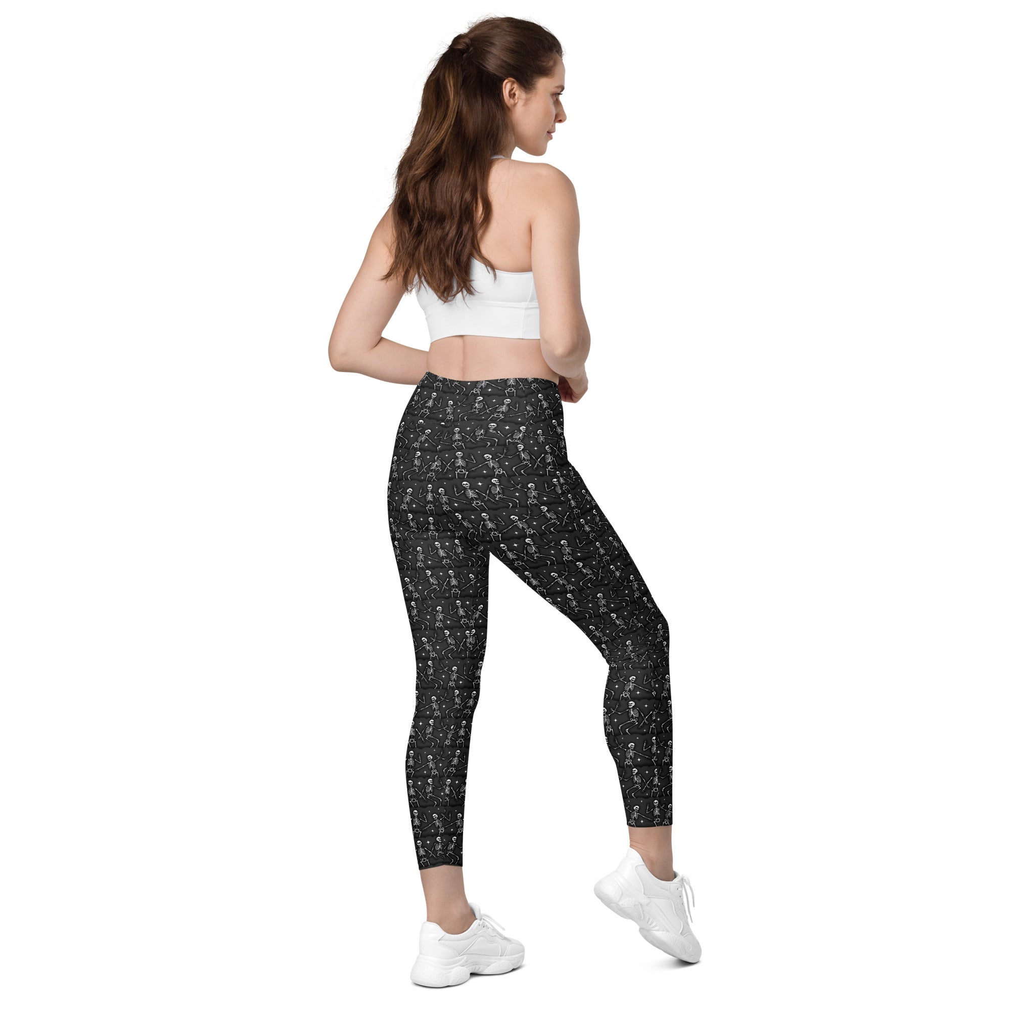 Printful DBD x Waffle Mamma Bone Dance crossover leggings with all-over print, pockets, white background, right back view