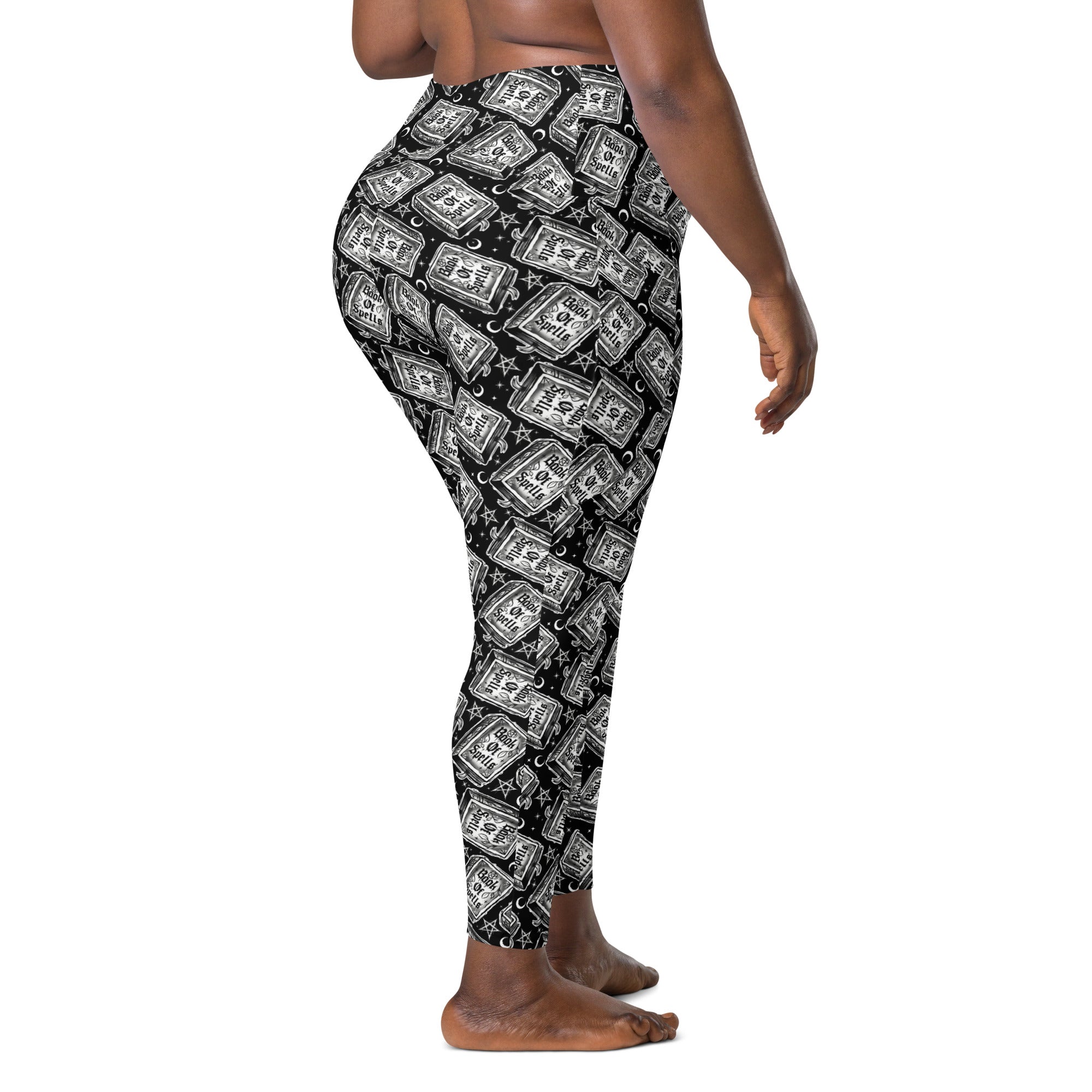 Printful Book of Spells crossover leggings with pockets, all-over print, white background, showcasing stylish and comfortable leggings.