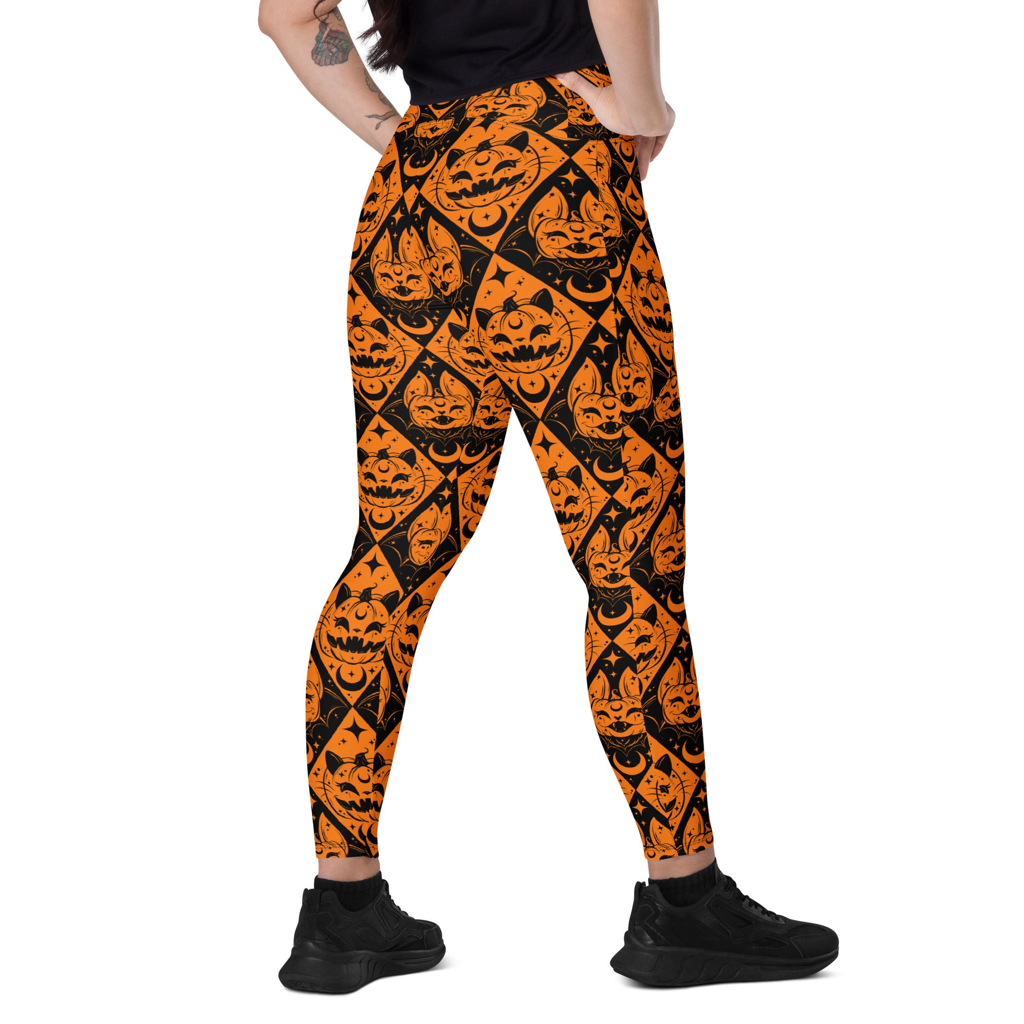 Printful Halloween cat and pumpkin crossover leggings with pockets, featuring a festive all-over print on white background.