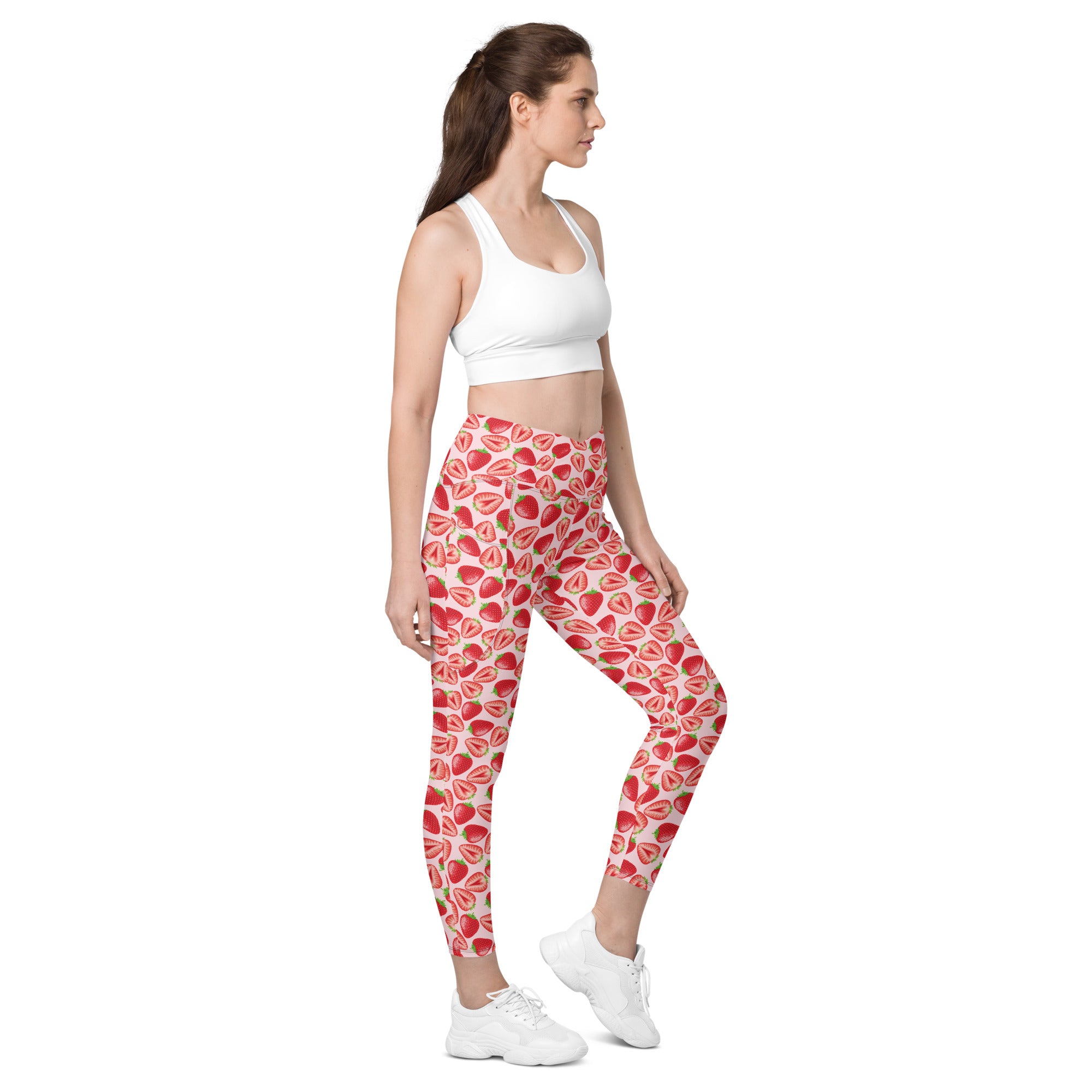 Printful crossover leggings with wild strawberry print, featuring pockets and all-over recycled fabric design, right front view.
