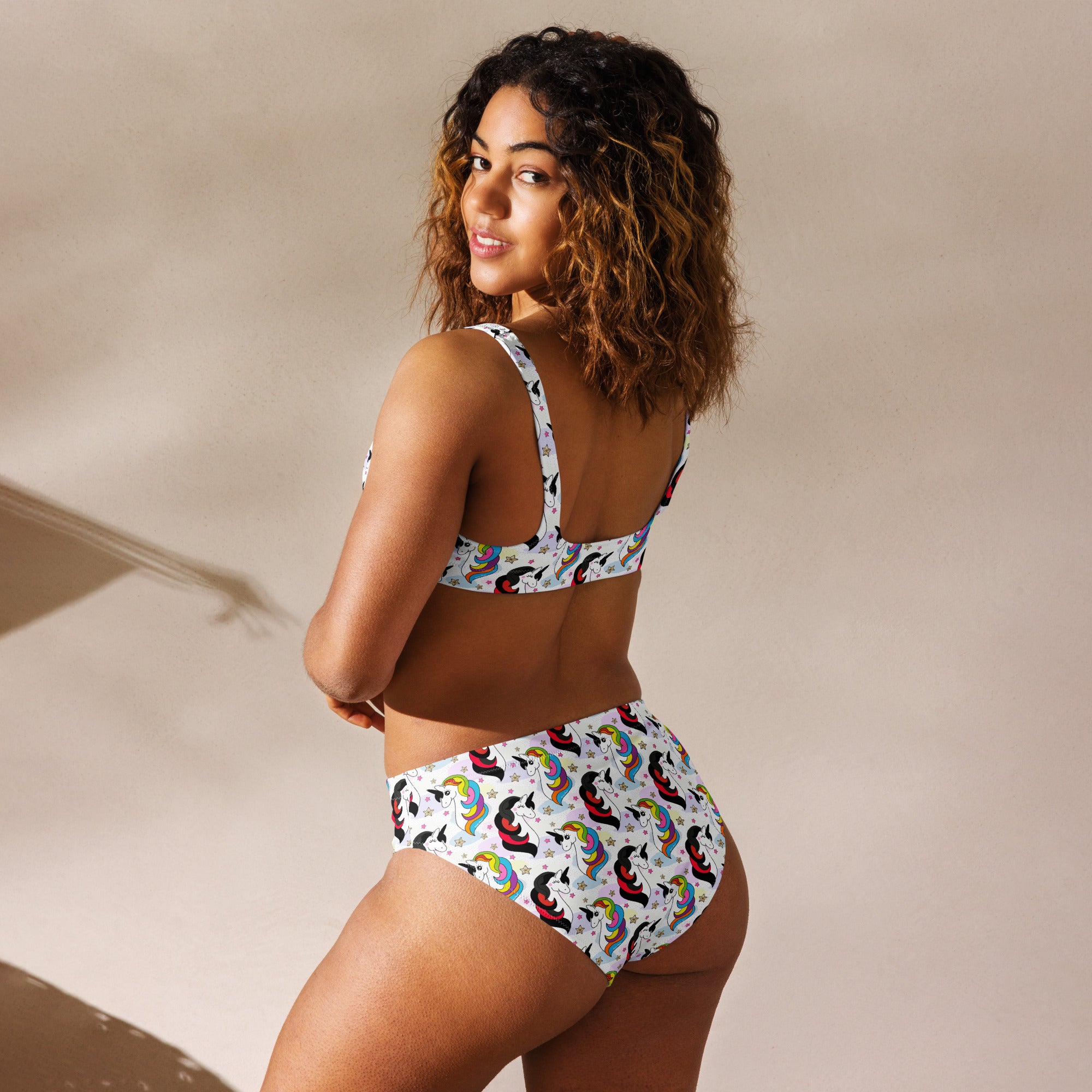 Recycled high-waisted bikini with unicorn print in white, featuring a full coverage back, available in XS to 3XL.