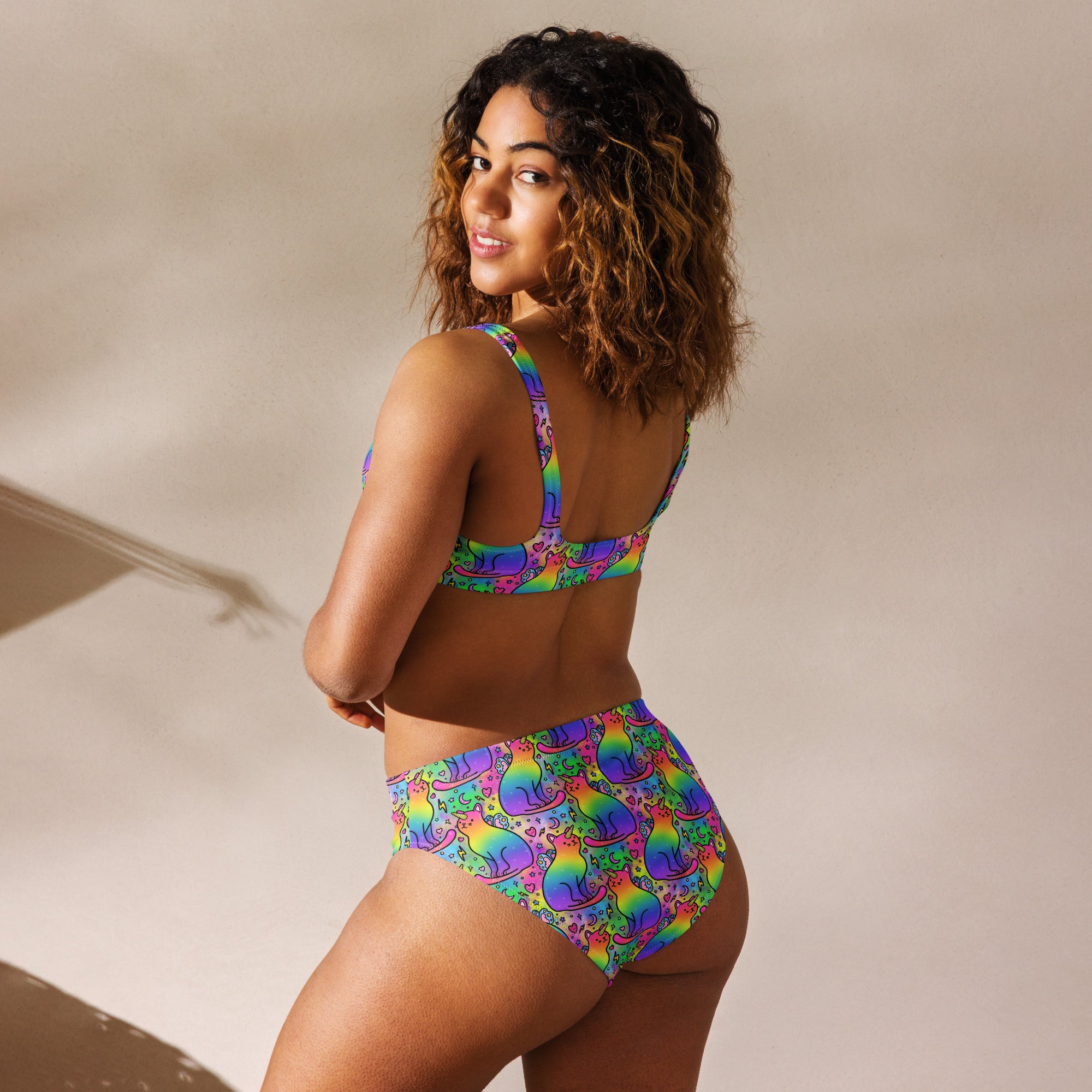 Recycled high-waisted bikini with rainbow unicorn cats print, white back, in XS to 3XL, by Printful.
