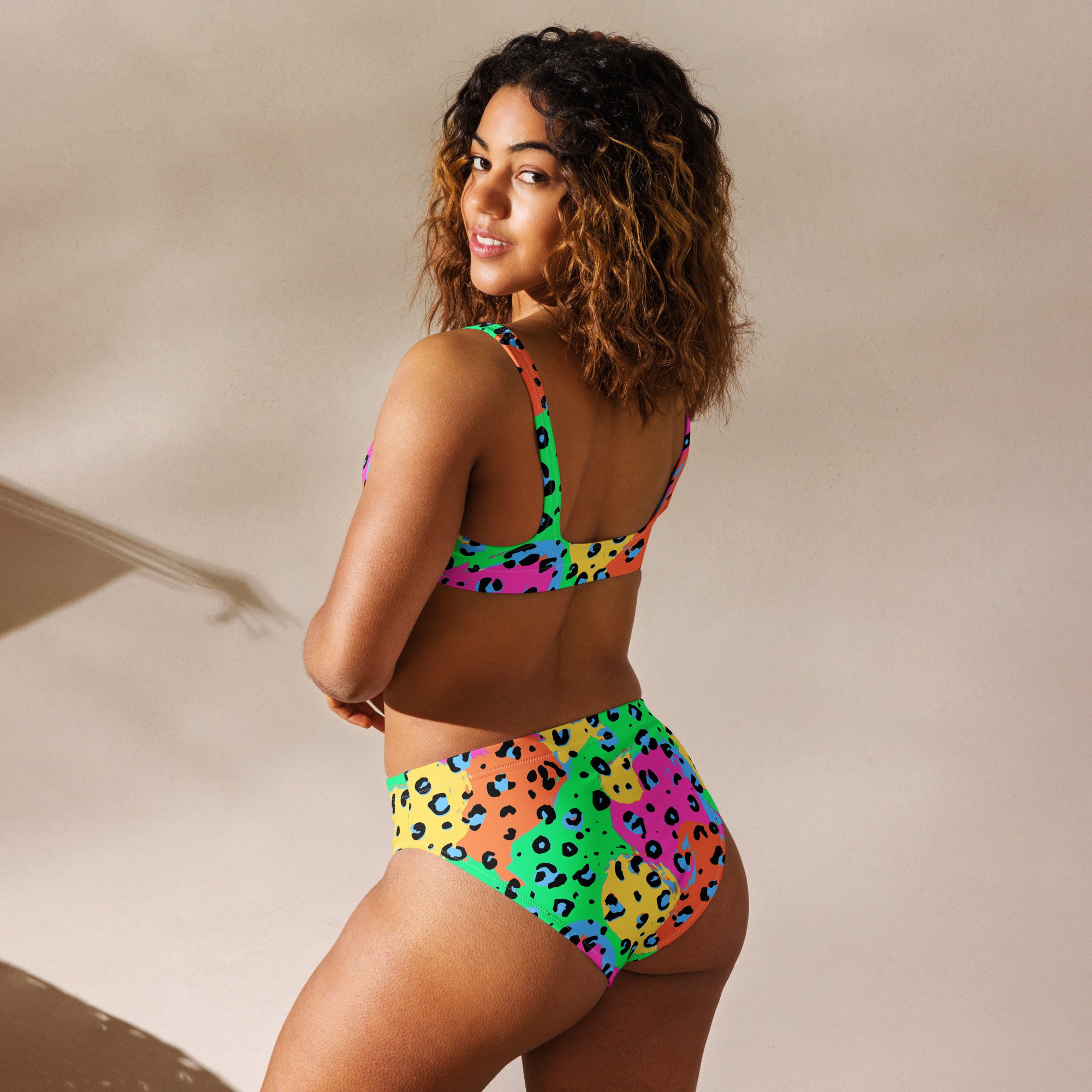 Recycled high-waisted bikini with neon swim safe leopard print, featuring a white back, designed by Printful.