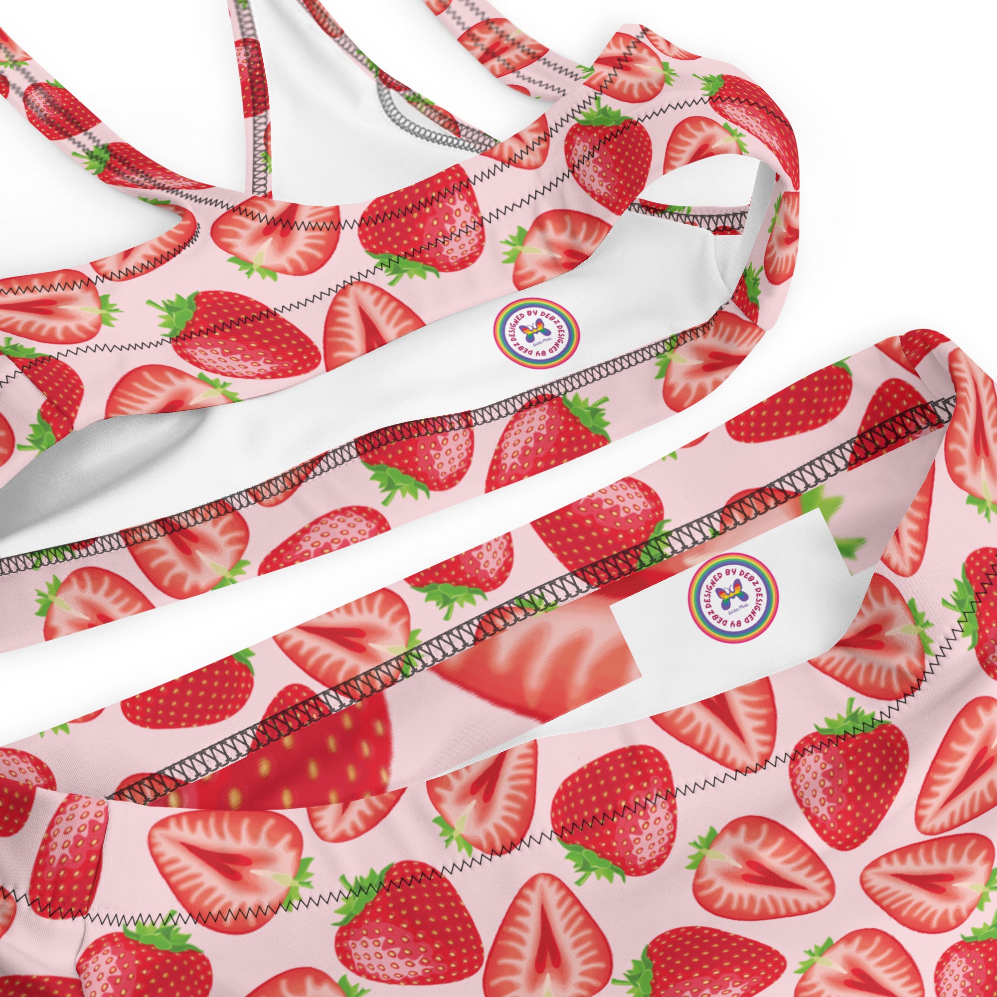 Recycled high-waisted bikini with realistic strawberry print in peach and white, featuring all-over print design.