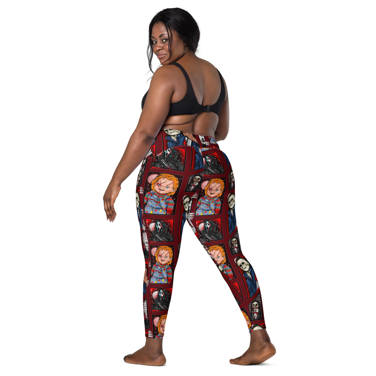 Recycled horror-themed leggings with pockets from Printful featuring all-over spooky print in white and black.