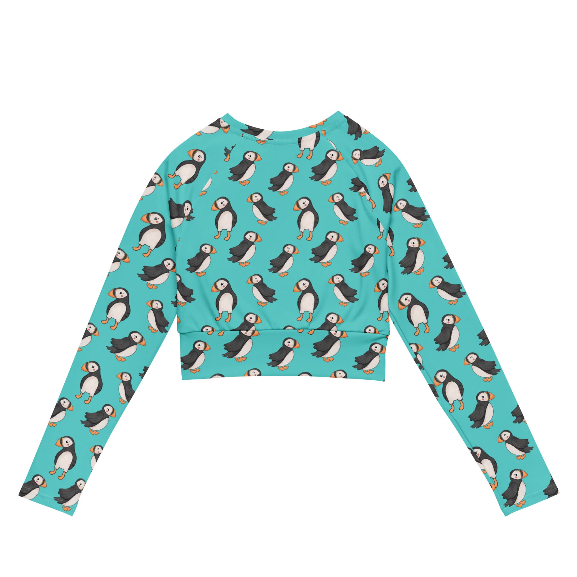 White Puffin Recycled Long-Sleeve Crop Top Rash Guard with all-over print, designed for active wear and eco-friendly fashion.