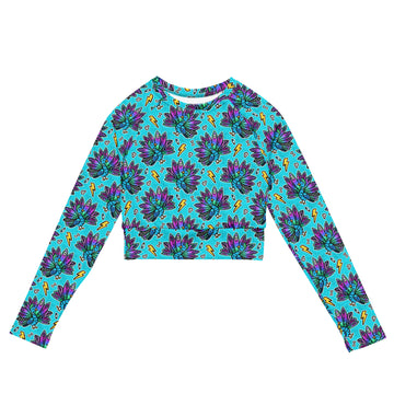 Printful electric peacock print rash guard crop top with long sleeves, UPF 50+ swimwear made from recycled materials, front view.