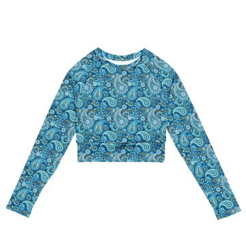 Blue paisley recycled long-sleeve crop top rash guard with all-over print, featuring a stylish design and fitted silhouette.