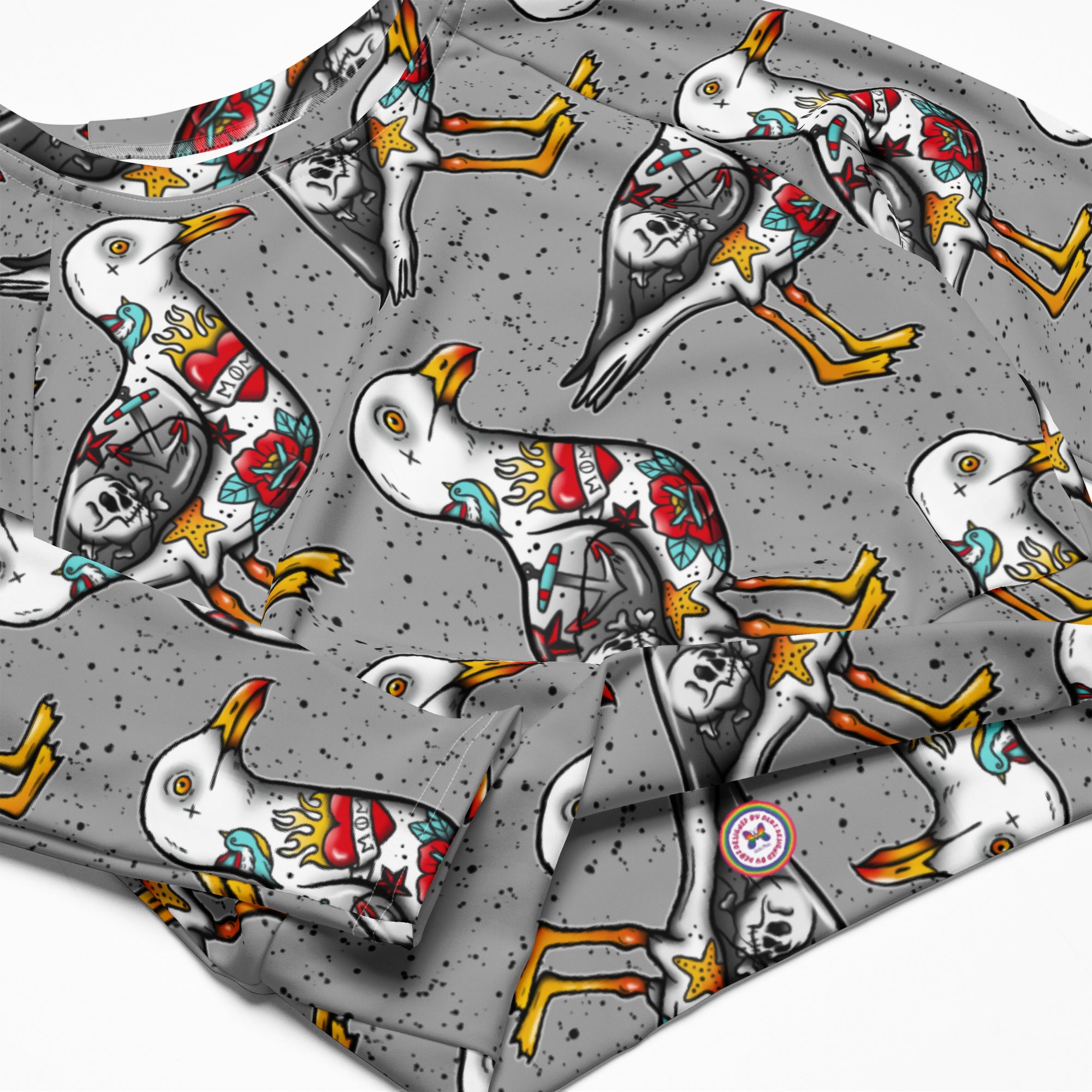 Grey Nautigul Seagull tattoo print recycled long-sleeve crop top by Printful, featuring all-over seagull tattoo design on white fabric.