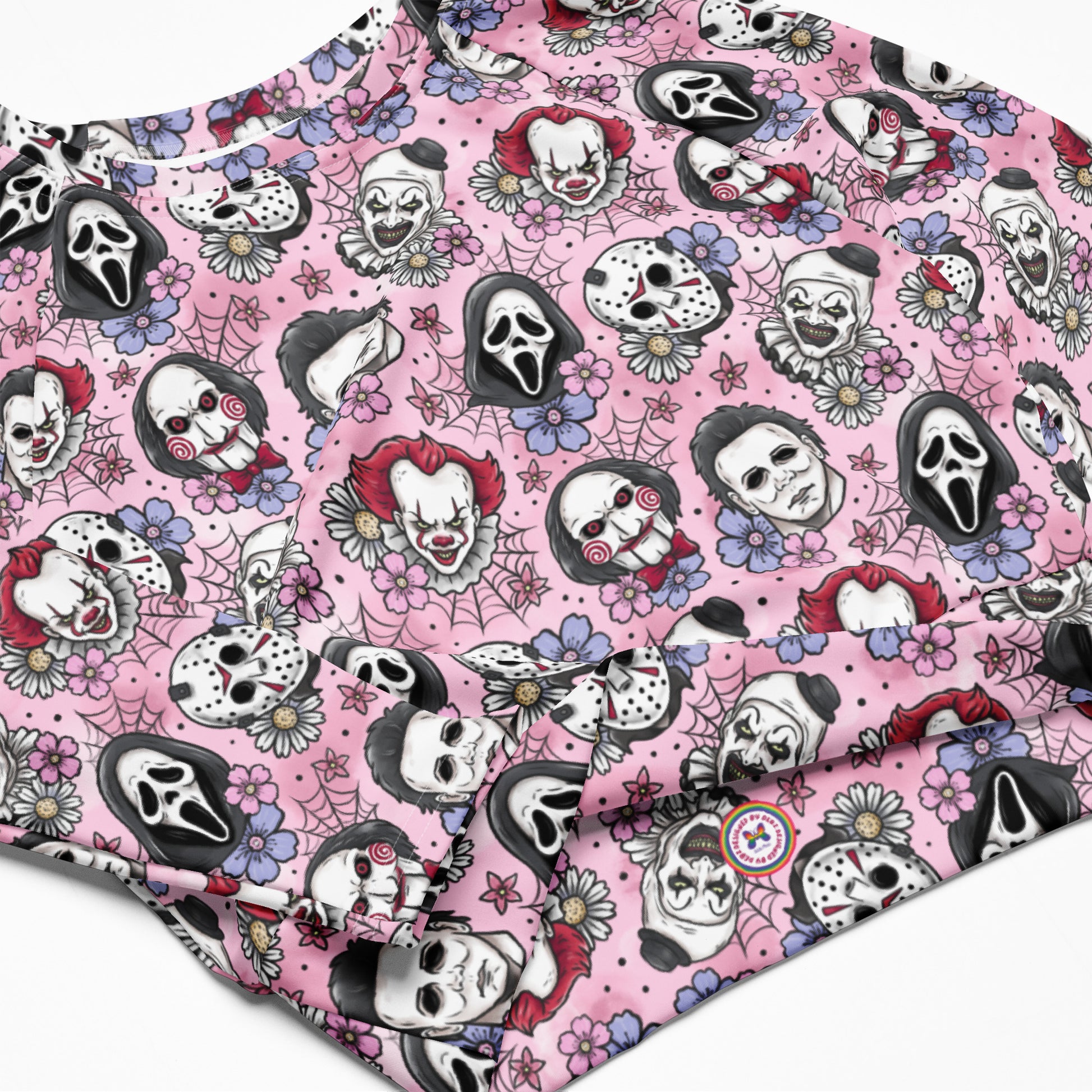 Pink Horror Characters recycled long-sleeve crop top rash guard with vibrant all-over print, designed for active wear and sun protection.