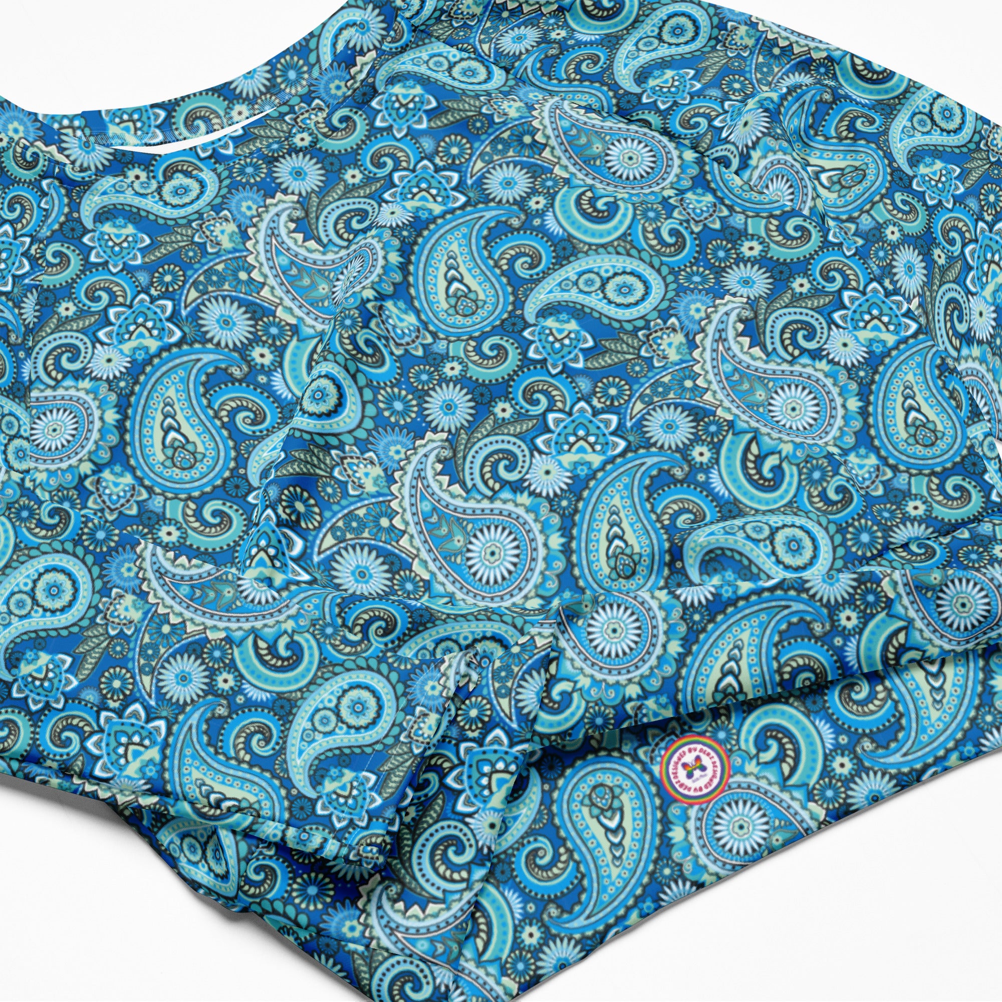 Blue paisley recycled long-sleeve crop top rash guard with all-over print, featuring a stylish design and long sleeves.