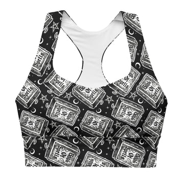 Printful Book of Spells recycled longline sports bra with all-over spell print, white background, front view, athletic and eco-friendly design