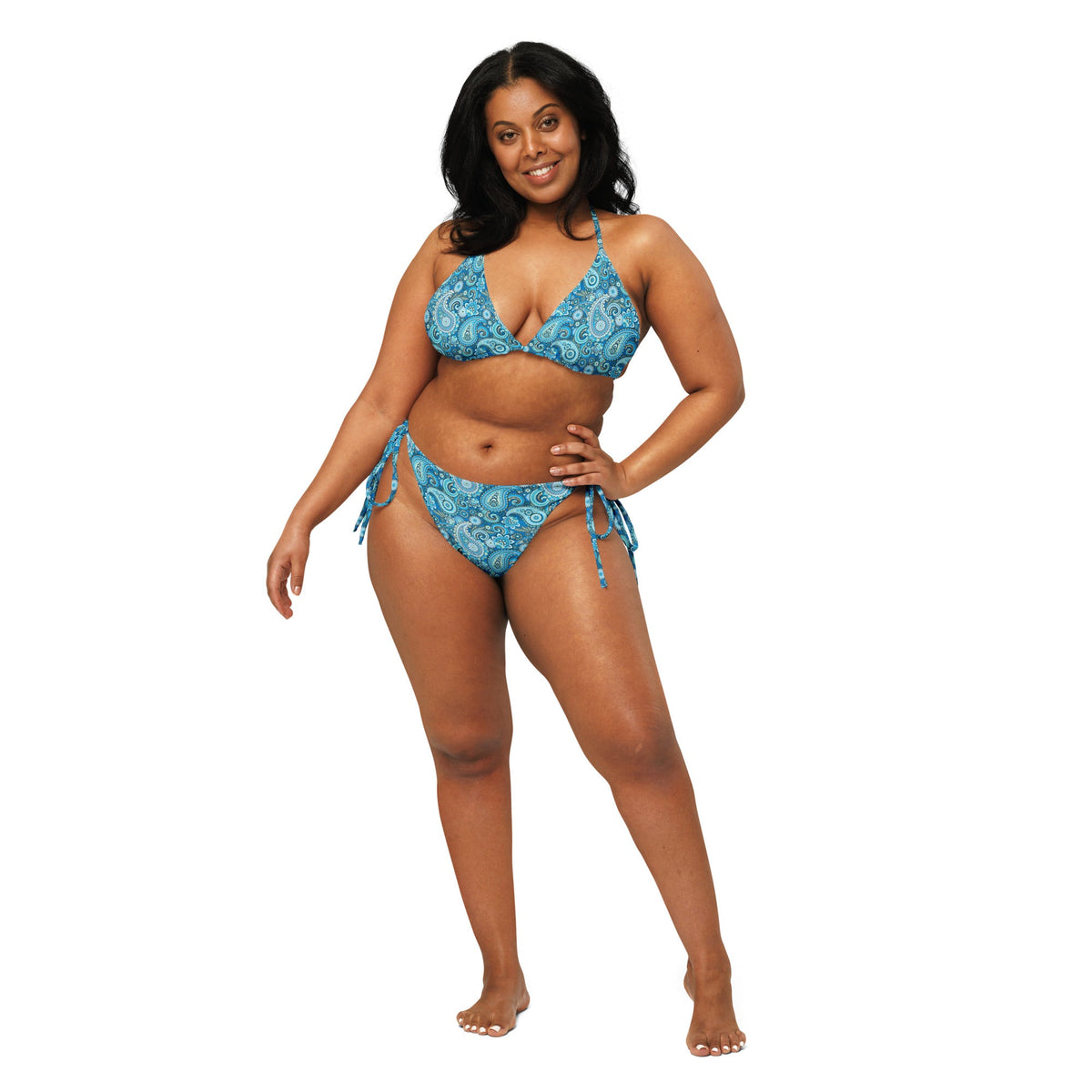 Blue paisley print triangle string bikini by Printful, featuring adjustable ties and recycled fabric, front view.