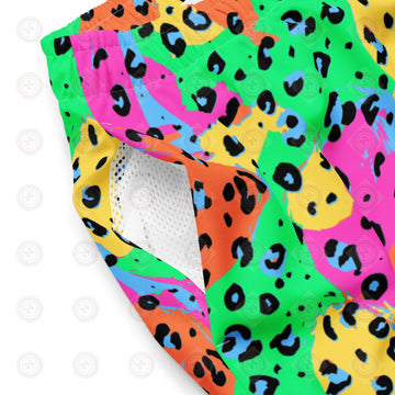 Neon leopard print swim trunks from Printful with all-over recycled fabric, featuring bright colors and a bold pattern.