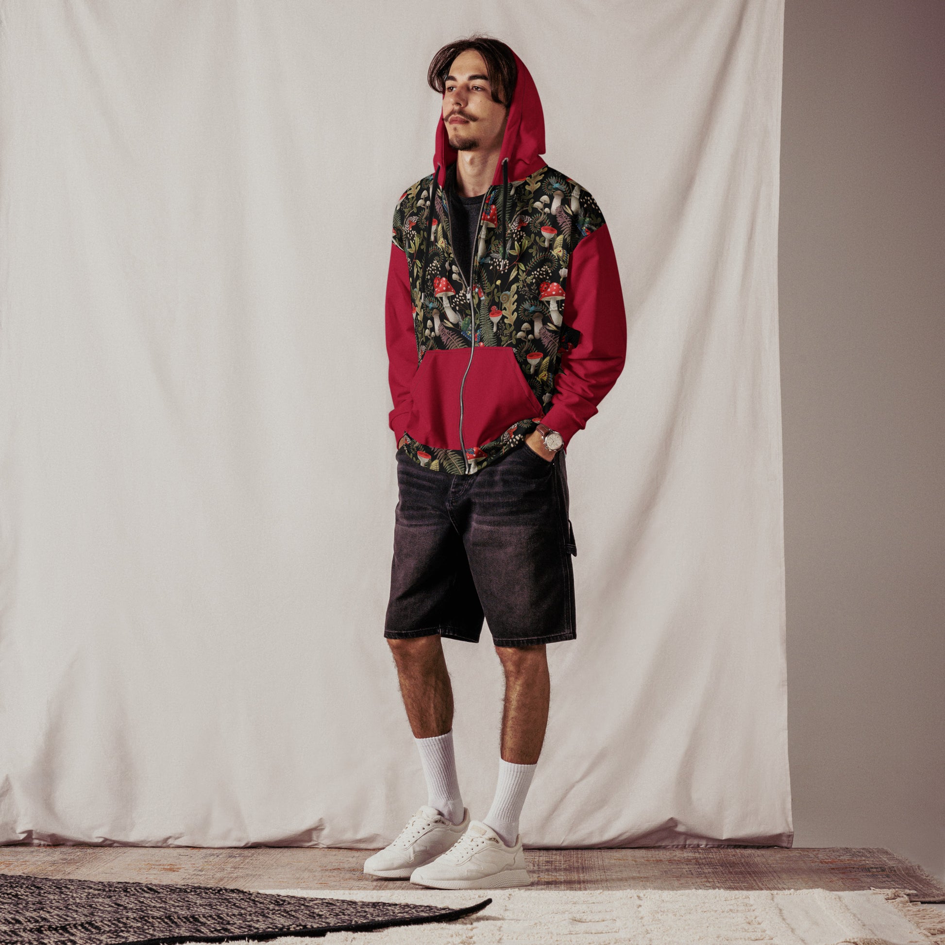 Unisex zip hoodie by Designed By Debz featuring all-over dark mushroom forest print in red and black on recycled fabric.