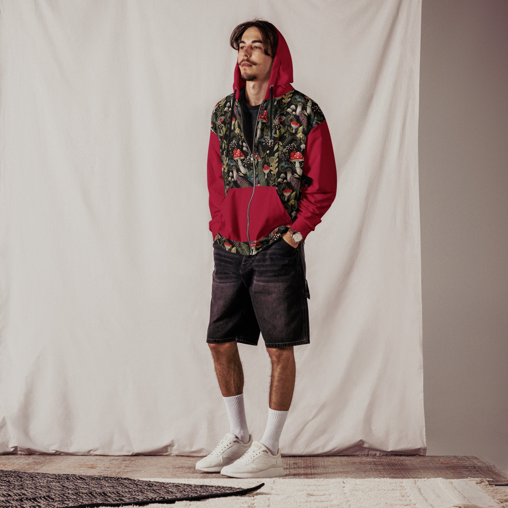 Unisex zip hoodie by Designed By Debz featuring all-over dark mushroom forest print in red and black on recycled fabric.